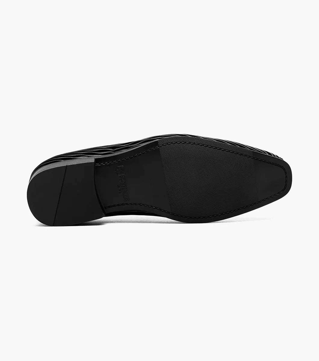 The Stacy Adams Seismith Plain Toe Slip On in black (style 25688-001) features a textured wavy pattern and a Memory Foam footbed, shown against a white background.