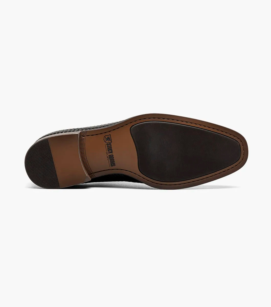 The Stacy Adams Keating Plain Toe Oxford (25709-001) is a black leather dress shoe with a woven pattern, closed lacing, cushioned footbed, and brown sole by STACY ADAMS, shown on a white background.