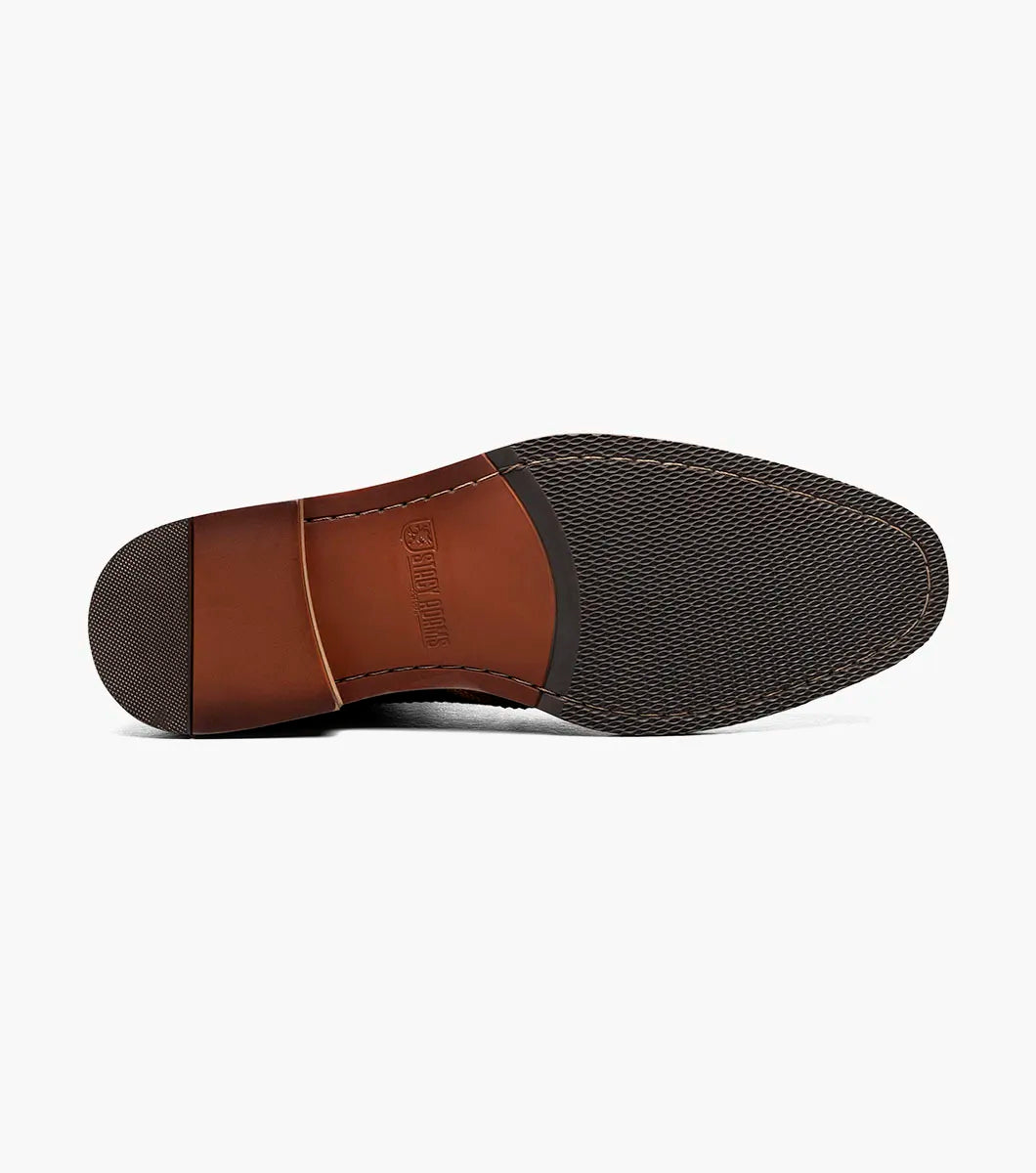 The STACY ADAMS Finnegan Wingtip Lace Up Boot (Cognac with Navy, 25427-470) features two-tone leather, brogue details, and a low heel—ideal for those seeking stylish and comfortable footwear. Shown in left profile on a white background.