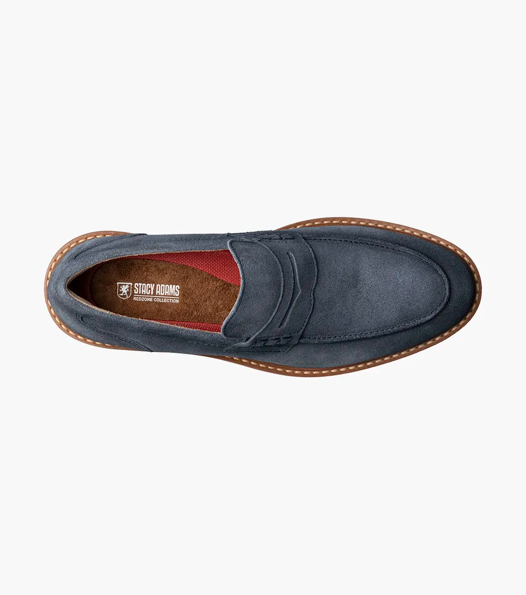 The Stacy Adams Hopkins Moc Toe Penny Slip On in navy suede features a moc toe, penny strap, white and tan rubber sole, and visible stitching, shown on a plain white background for comfort and style.