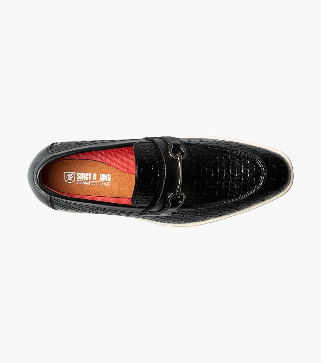 The STACY ADAMS Salyer Moc Toe Bit Slip On (25692-001) features black textured leather, a metal bit detail, and a white sole—perfect for dress occasions, shown on a plain white background.