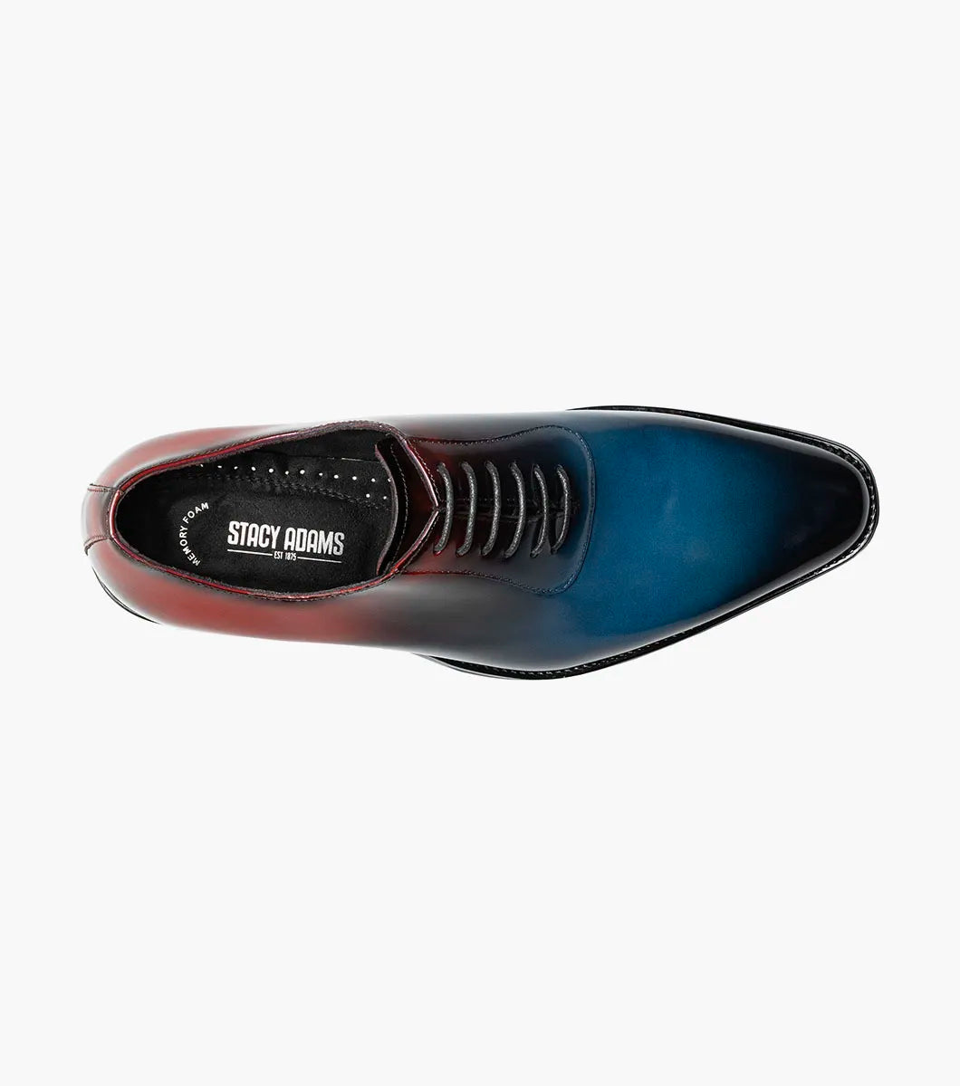 The STACY ADAMS Shaffer Plain Toe Oxford (Navy Multi, 25763-492) features premium calf leather with a gradient from deep red heel to blue toe, dark laces, and a black sole.