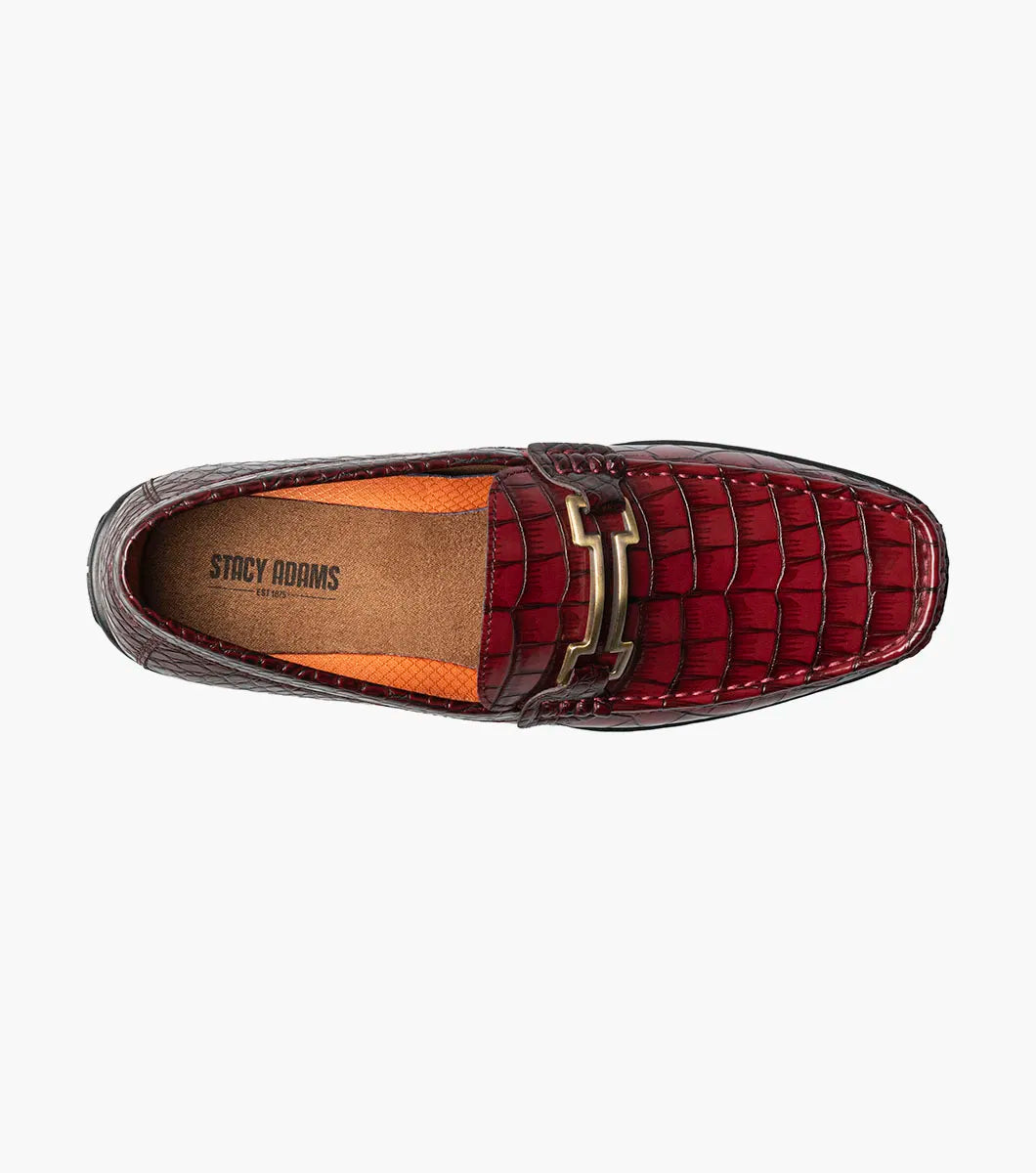 The STACY ADAMS Embrey Moc Toe Bit Slip On in Wine (25703-609) features a single red crocodile print loafer with a metal bit detail on the man-made upper, shown against a white background.