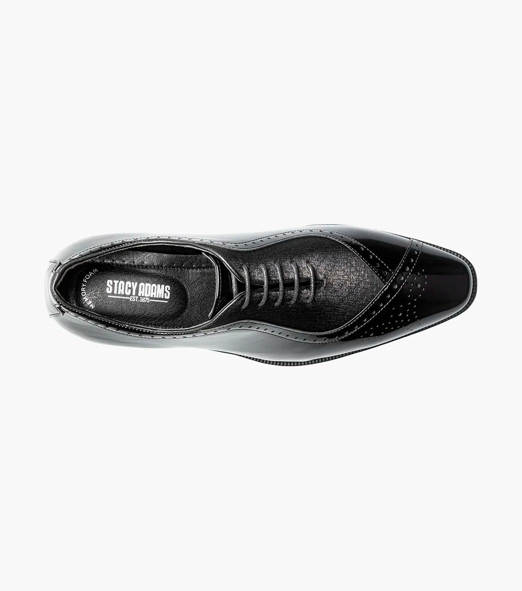A single STACY ADAMS Stuart Folded Vamp Balmoral Oxford dress shoe in black patent leather (Style 25794-001), featuring laces, a low heel, decorative stitching, and a comfortable Memory Foam insole, is displayed on a plain white background.