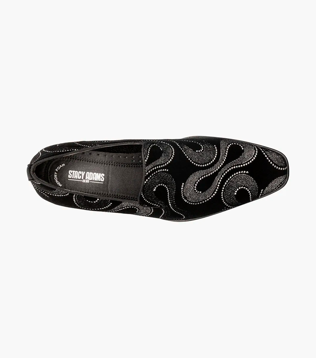 The Stacy Adams Swainson Plain Toe Embroidered Slip On (Black and Silver, 25669-042) features black suede, swirling silver and black embroidery, a low heel, and a memory foam insole for effortless style and comfort.