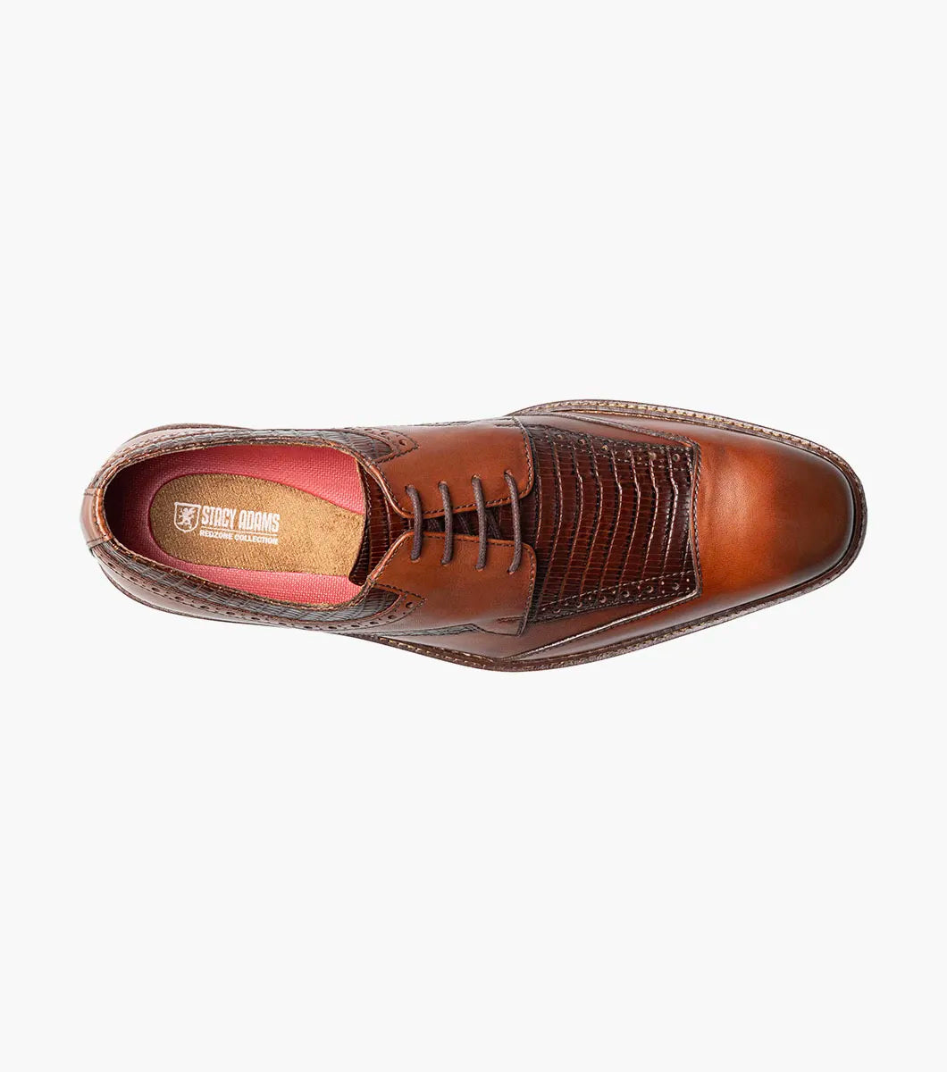 The Stacy Adams Gambetta Modified Cap Toe Oxford in cognac features textured detailing, lace-up closure, and a low heel, displayed on a white background.
