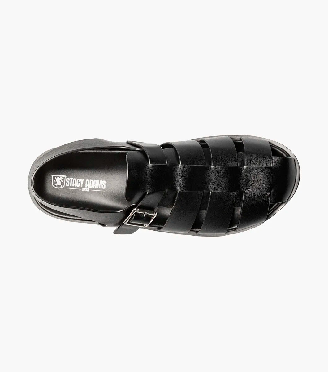 A black STACY ADAMS Montego Slingback Buckle Sandal (25659-001) with a closed toe, cushioned EVA midsole, and buckle strap is shown in profile against a white background.
