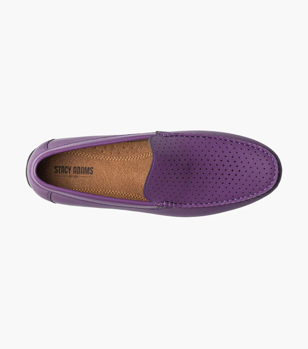 The STACY ADAMS Conroy Moc Toe Perf Slip On in purple (25702-542) features a perforated leather upper, cushioned footbed, black sole, and slip-on design, shown against a plain white background.