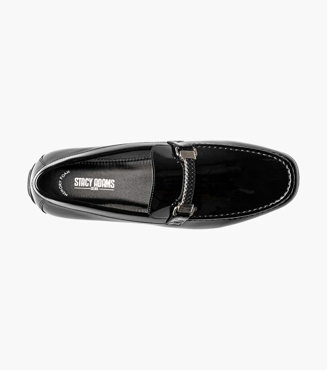 The STACY ADAMS Sheridan Moc Toe Bit Slip On (Black Patent, 25761-004) is shown: a single low-heeled loafer with black patent leather, braided strap detail, and classic styling on a plain white background.