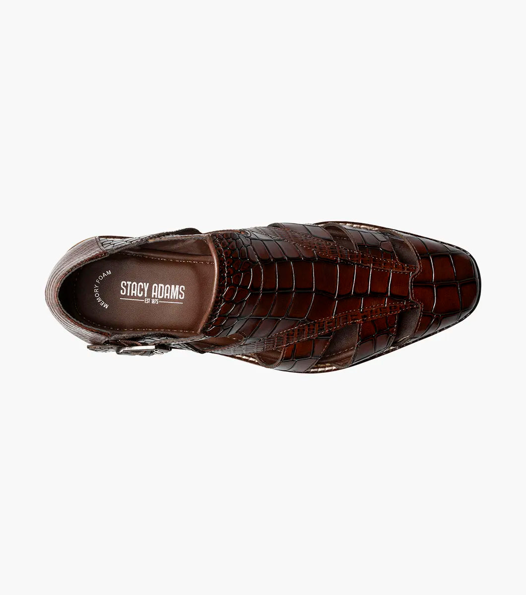 The STACY ADAMS Calandro City Sandal (Cognac, 25695-221) is a brown genuine leather dress shoe with a crocodile pattern, cushioned footbed, side buckle, and closed toe, displayed on a white background.