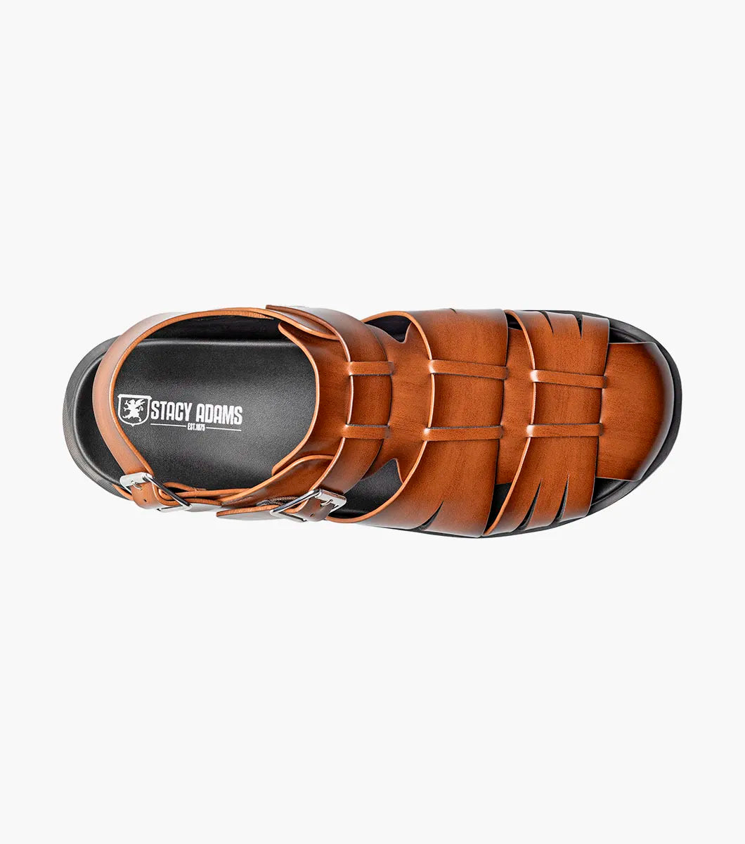 The STACY ADAMS Largo Slingback Buckle Sandal in cognac features a closed toe, woven leather upper, adjustable side buckle, and cushioned black sole—perfect men’s summer footwear. Shown here in style 25773-221 on a white background.