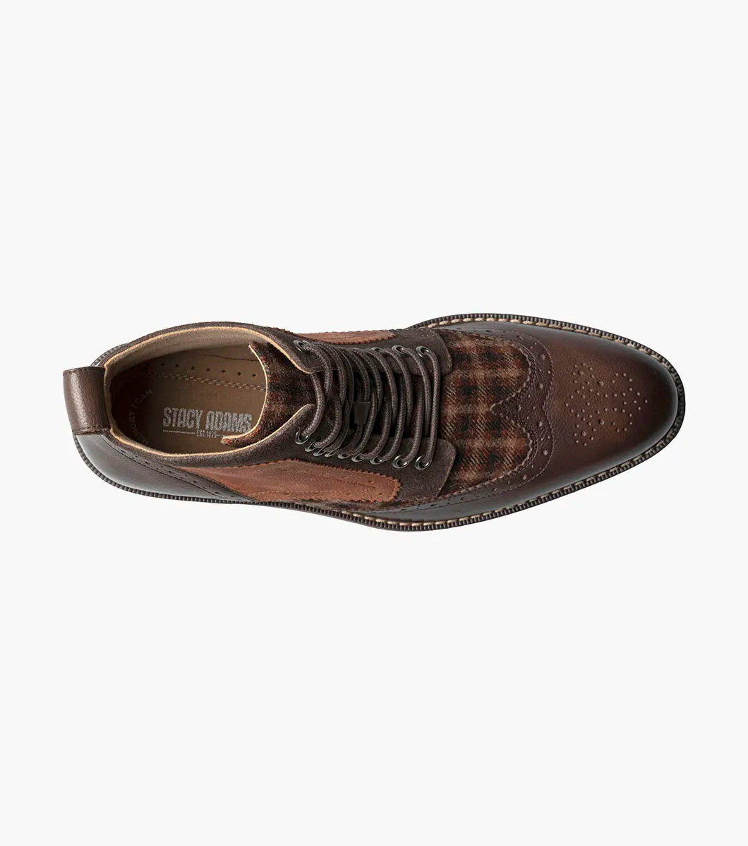 The STACY ADAMS Finnegan Wingtip Lace Up Boot in Brown Multi features leather and suede, perforated details, a patterned fabric panel, low wooden heel, and cushioned memory foam insole for comfort. Style #: 25427-249.