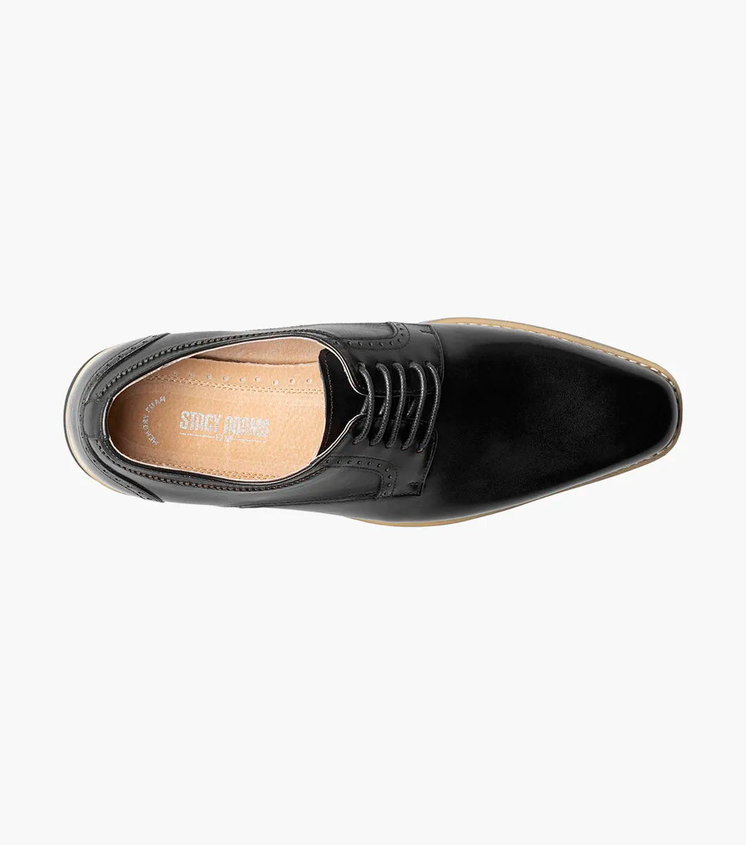 The Stacy Adams Barringer Plain Toe Oxford (Black, 25722-001) features lace-up leather with subtle crocodile print, tan trim, and a white and black rubber sole, shown in a side view on a plain white background.