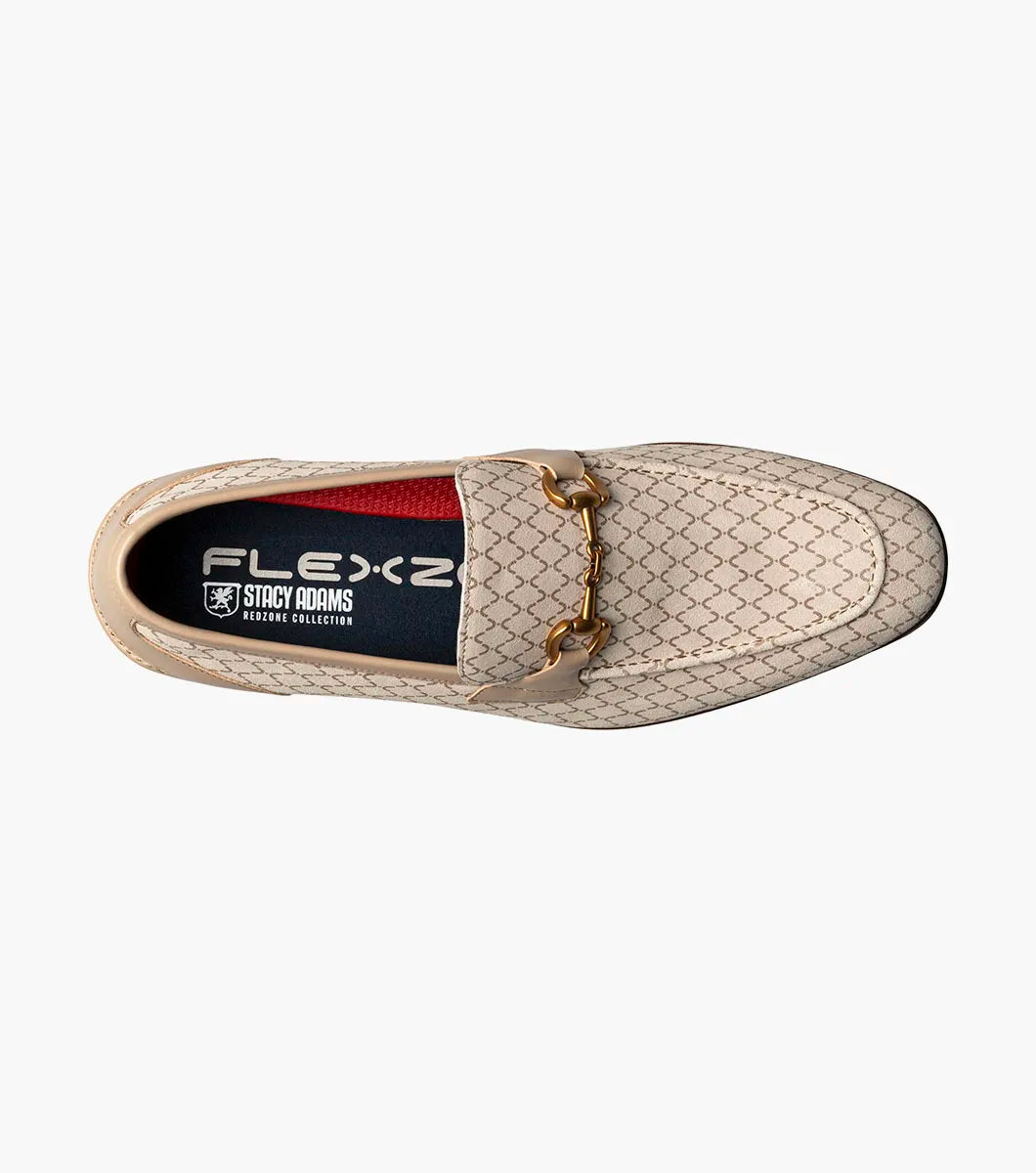The Stacy Adams Brinkley Moc Toe Bit Slip On in beige features a geometric pattern, leather trim, gold bit detail, wooden heel, and a FlexZone footbed for all-day comfort.