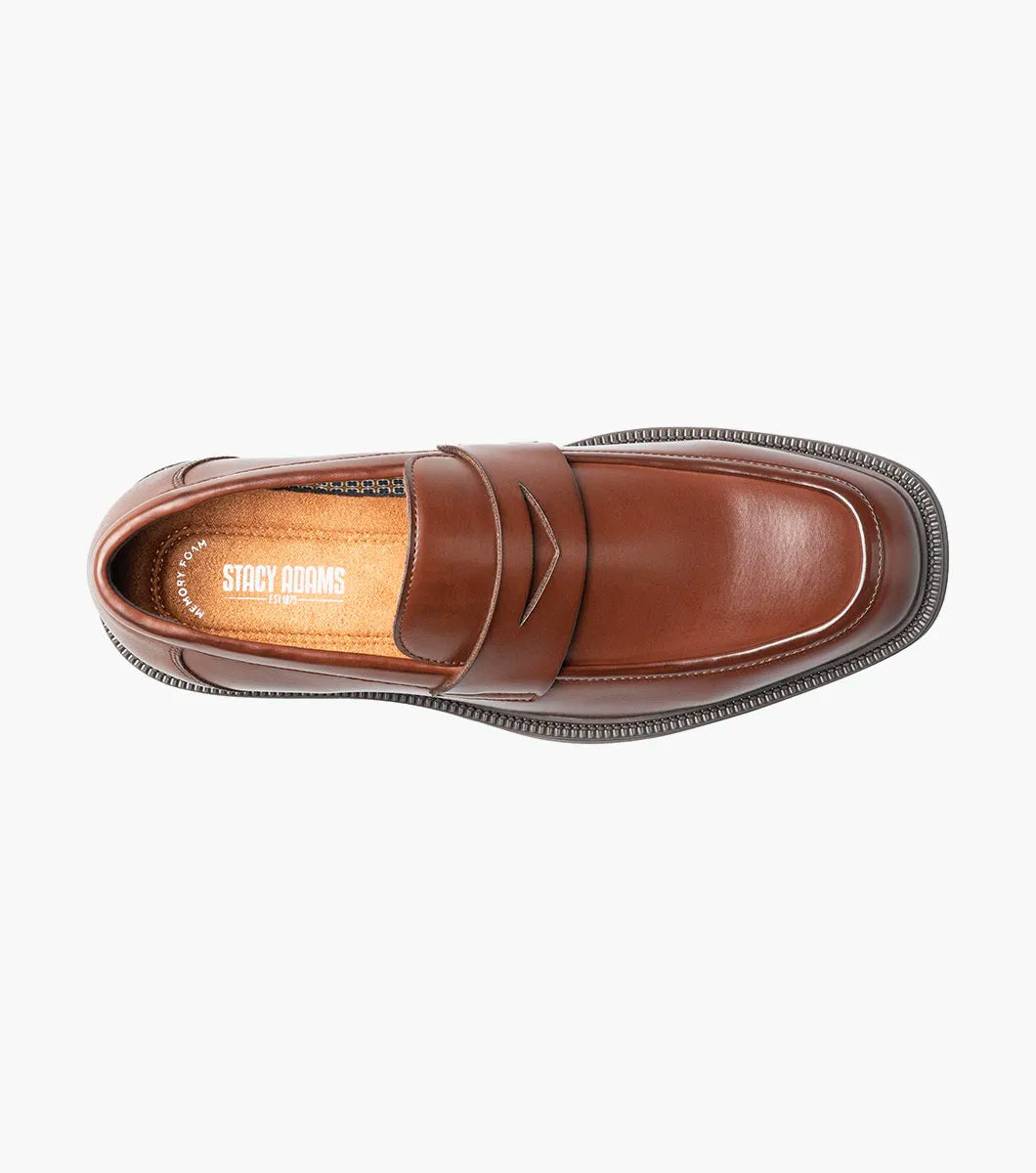 The STACY ADAMS Everett Moc Toe Penny Slip On in brown (style 25790-200) features a classic moc toe design with stitching details, a low heel, a rounded toe, and cushioned comfort from its memory foam insole, shown here against a plain white background.