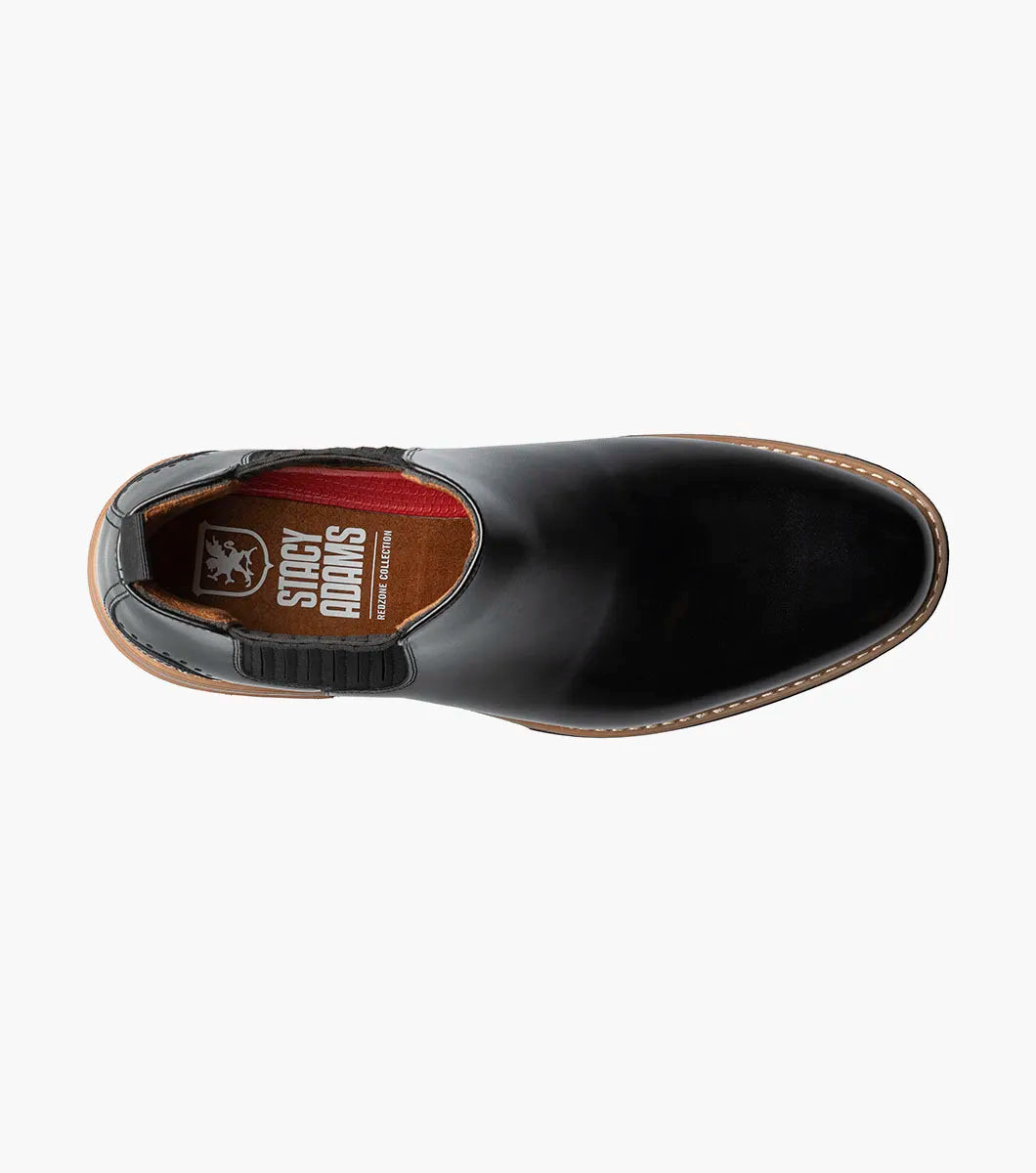 The STACY ADAMS Platt Plain Toe Chelsea Boot (Black, 25755-001) features sleek leather, elastic side panels, a brown sole, and a back pull tab—an elegant choice for any men’s boot collection.