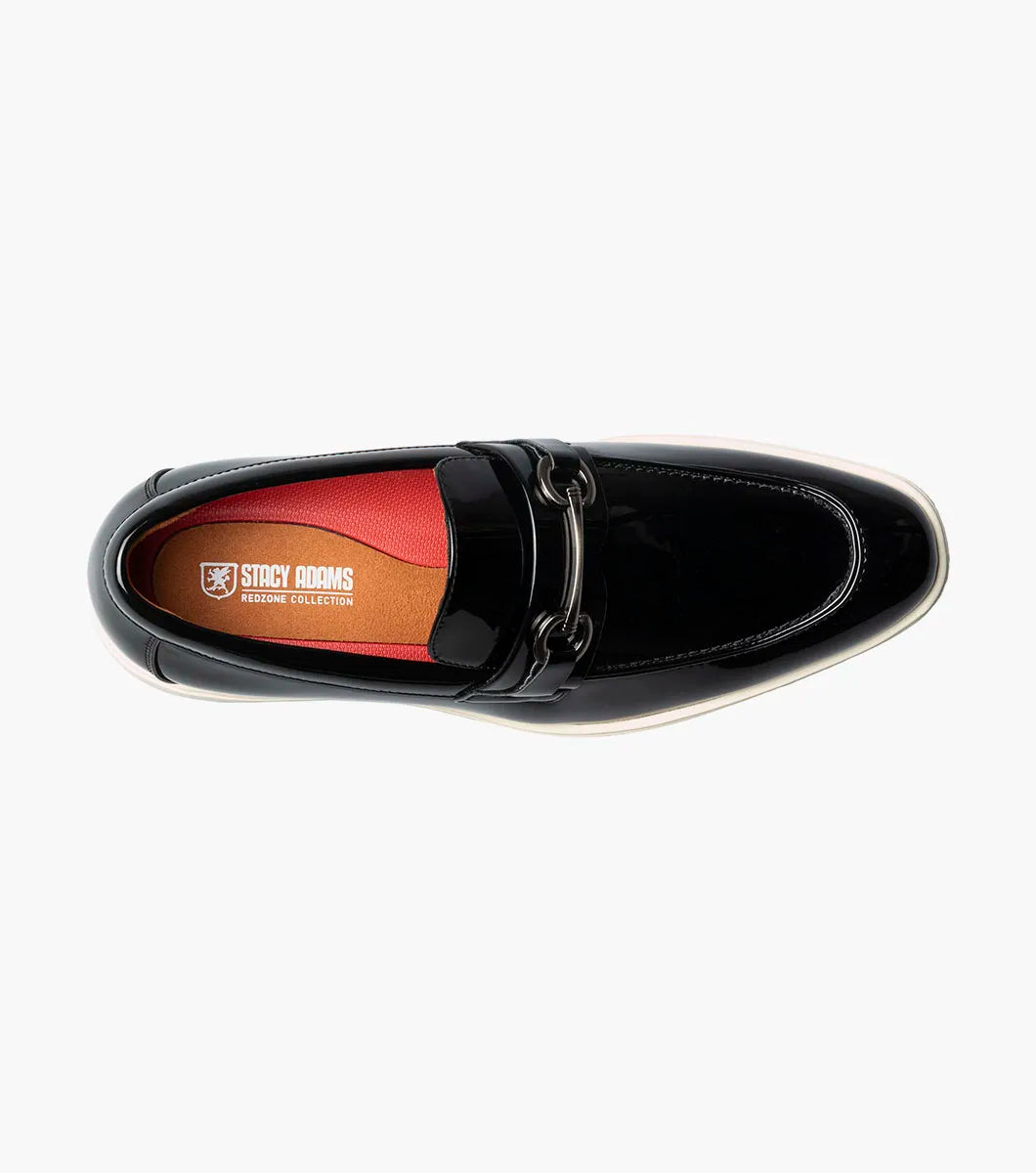 The Stacy Adams Slayton Moc Toe Bit Slip On (25710-004) is a black patent leather loafer with a white sole, displayed in side profile against a plain white background.