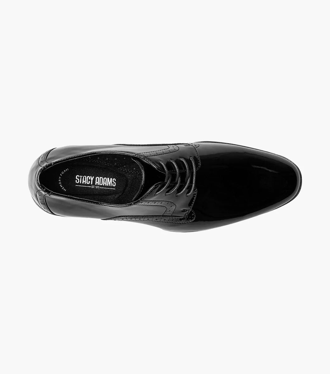The STACY ADAMS Scottie Plain Toe Oxford (Black Patent, 25701-004) is a black patent leather lace-up dress shoe with anatomical arch support, shown in side profile against a white background.
