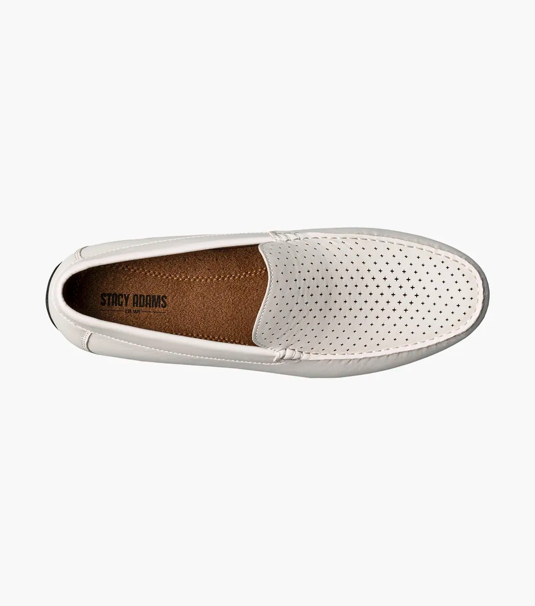 The Stacy Adams Conroy Moc Toe Perf Slip On in white features a perforated leather upper, visible stitching, black rubber sole, and cushioned footbed for comfort. Shown in side profile on a plain background.
