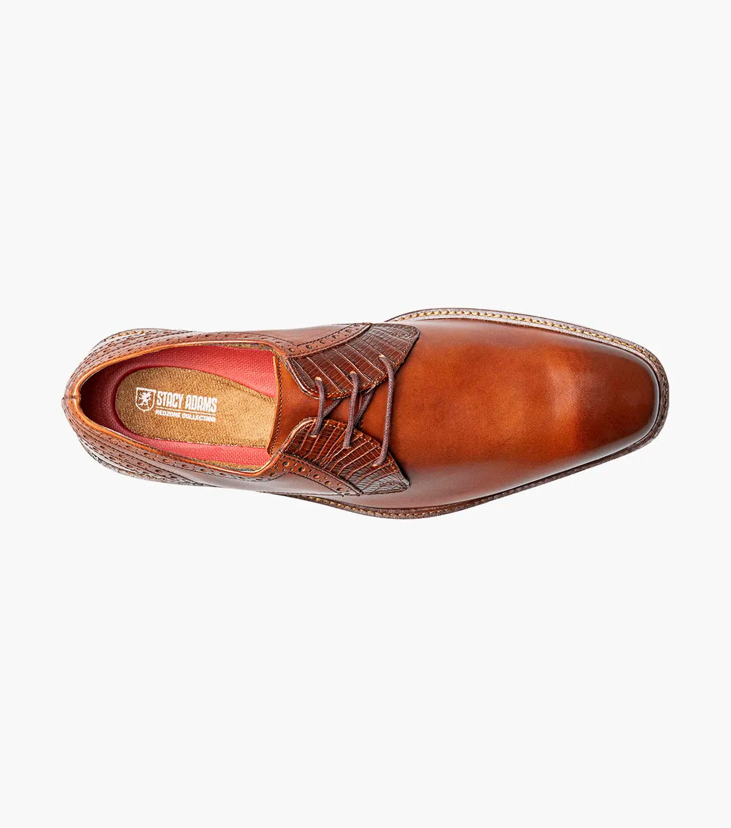 The Stacy Adams Giorgetti Plain Toe Oxford in Cognac features lizard print leather, brogue details, textured accents, a cushioned footbed, low heel, and lace-up closure.
