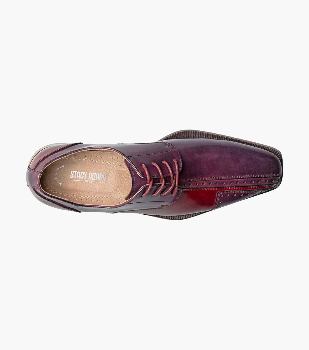 The STACY ADAMS Palmento Modified Cap Toe Oxford in Burgundy Multi (25740-641) features a polished leather upper, brogue accents, lace-up closure, Memory Foam insole, and wooden sole. Single shoe shown on white background.