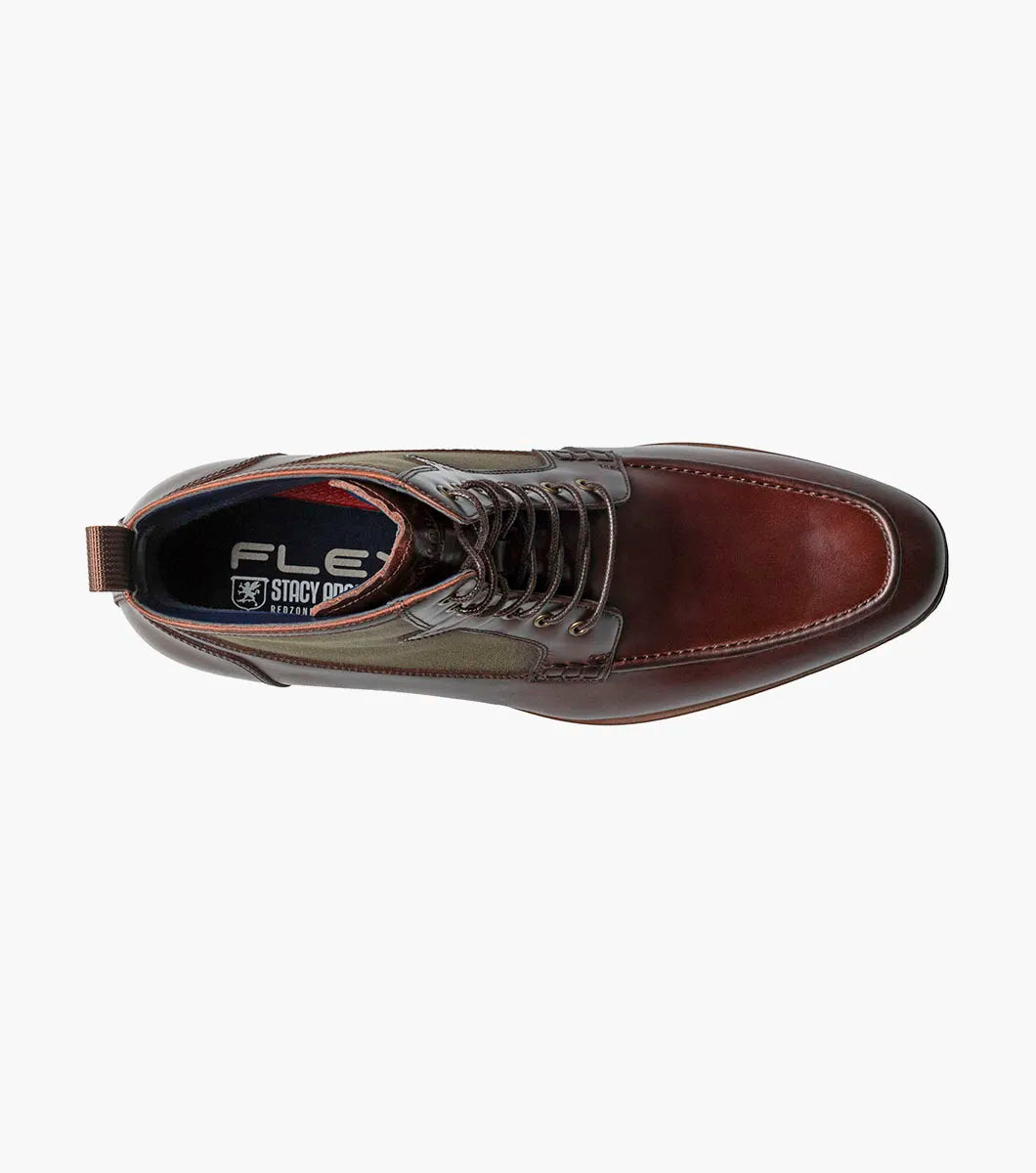 The Stacy Adams Brumley Moc Toe Lace Up Boot in Brown Multi features burnished leather and olive green fabric, a lace-up closure, cushioned footbed, and low stacked heel for lasting comfort and style.
