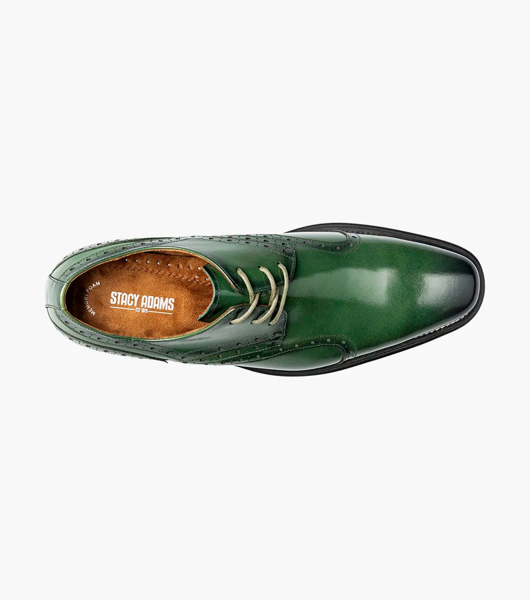 The Stacy Adams Alexander Plain Toe Oxford (25791-300) in polished green calf leather features decorative stitching and perforations, classic laces, a low black heel, and a comfortable Memory Foam insole—all showcased against a plain white background.