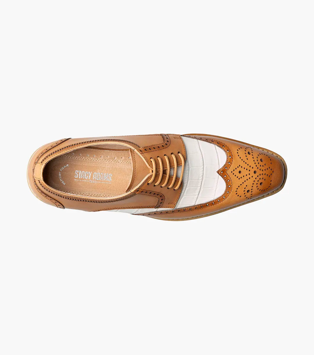 The Stacy Adams Beaumont Wingtip Oxford in Natural Multi (25723-289) features brown and white leather, brogue detailing, leather lining, and a white sole, shown here against a white background.