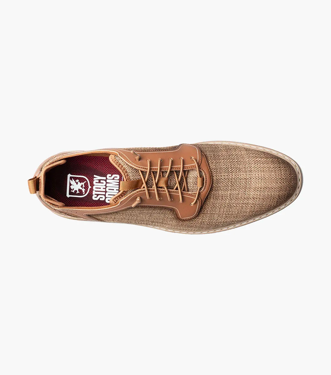 The Stacy Adams Sebert Plain Toe Elastic Lace Up in tan features a textured fabric upper, leather accents, anatomical arch support, and a light rubber sole for comfort, shown on a white background.