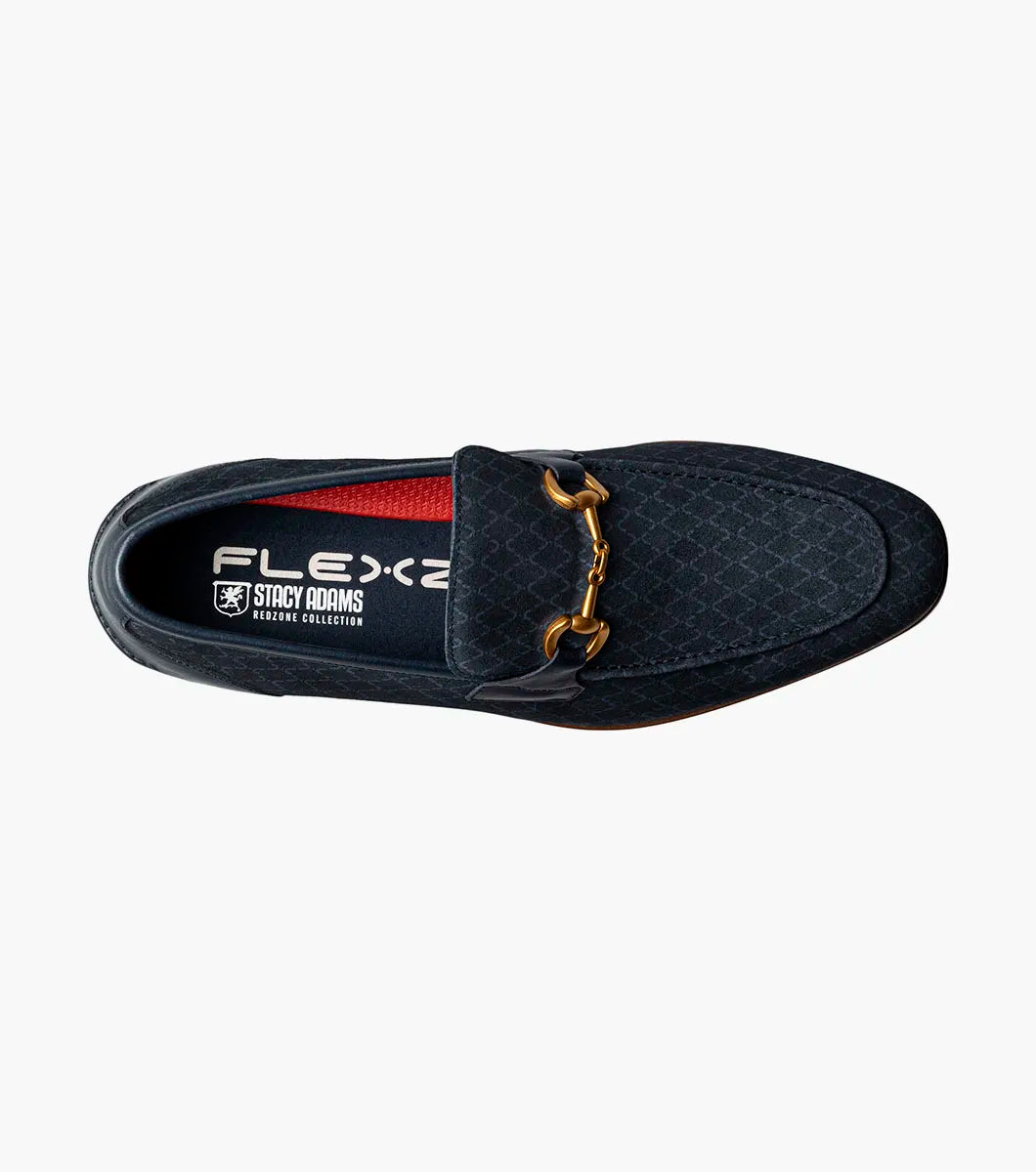 The STACY ADAMS Brinkley Moc Toe Bit Slip On (Navy, 25711-410) features a dark blue suede upper, gold horsebit detail, leather trim, and wooden sole, displayed against a plain white background.