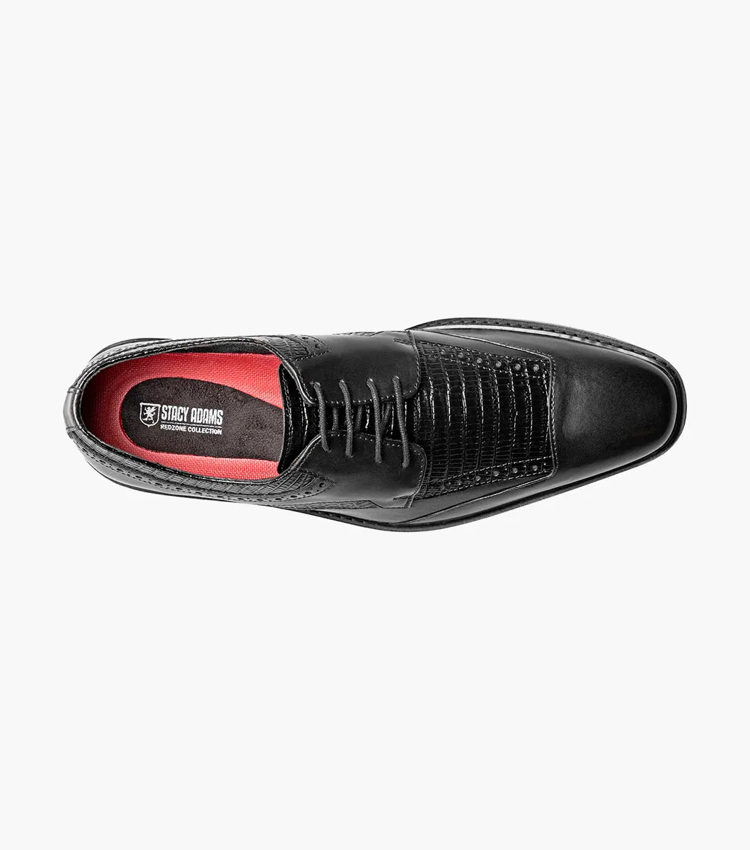 The Stacy Adams Gambetta Modified Cap Toe Oxford (25780-001) is a black leather dress shoe with textured detailing, lace-up closure, low heel, and RedZone footbed, shown on a plain white background.