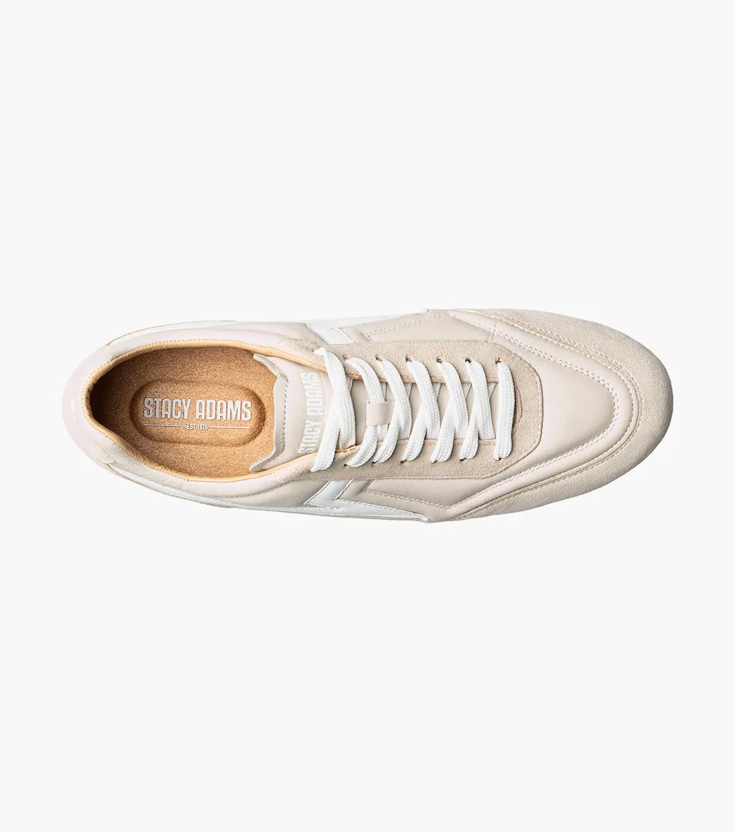 The STACY ADAMS Stacy Adams - Action 150 Sporty Lace Up in Cream (25797-113) is a beige and white low-top modern sneaker with a cushioned footbed, featuring white laces, sleek white side detailing, and a tan rubber sole, photographed on a white background.