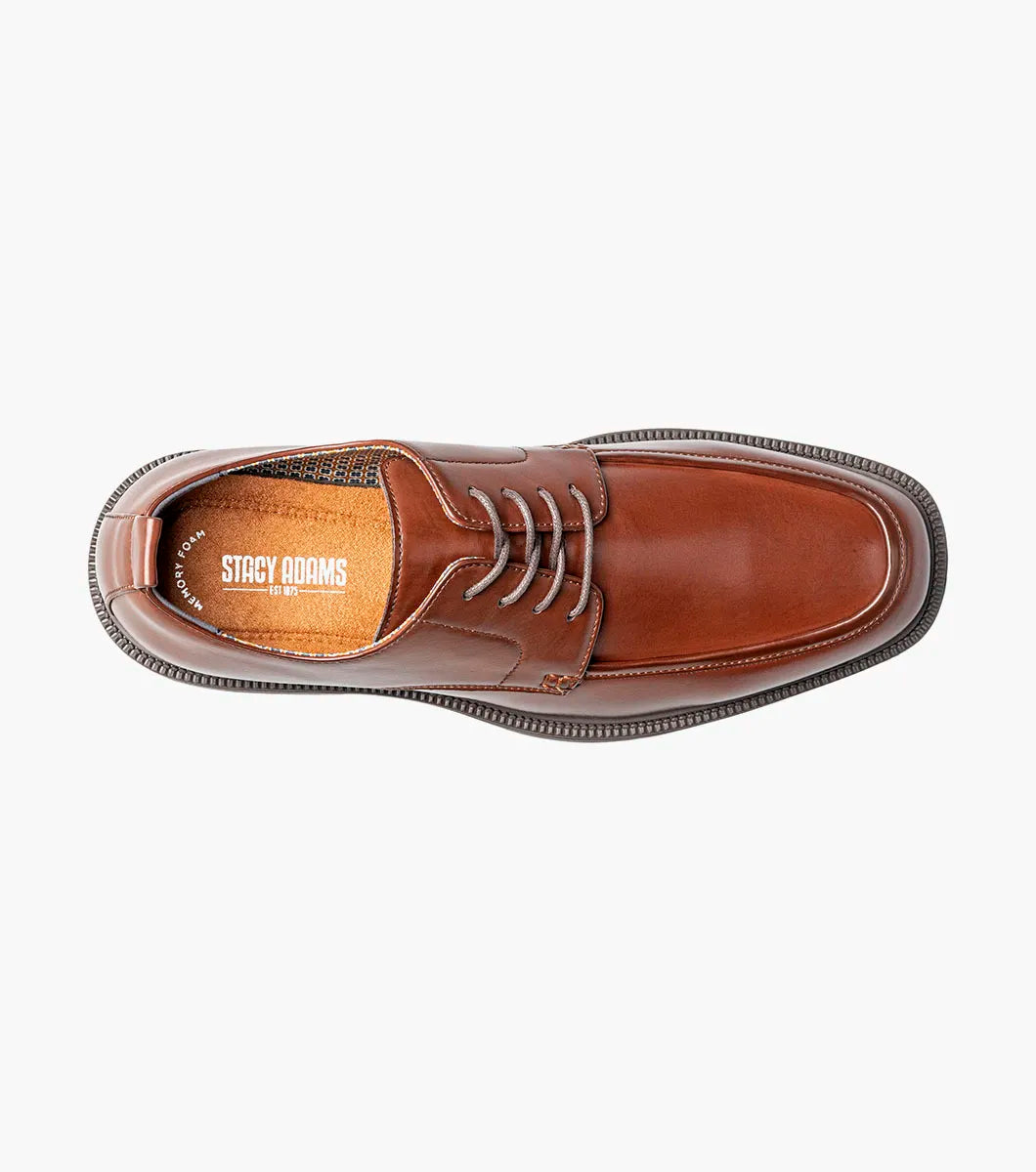 Introducing the Stacy Adams Evan Moc Toe Oxford in brown (style 25789-200)—a men’s dress shoe from STACY ADAMS featuring a moc toe design, black laces, a rounded toe, and a contrasting black sole. This stylish oxford is equipped with a Memory Foam footbed for enhanced comfort and is showcased against a white background.