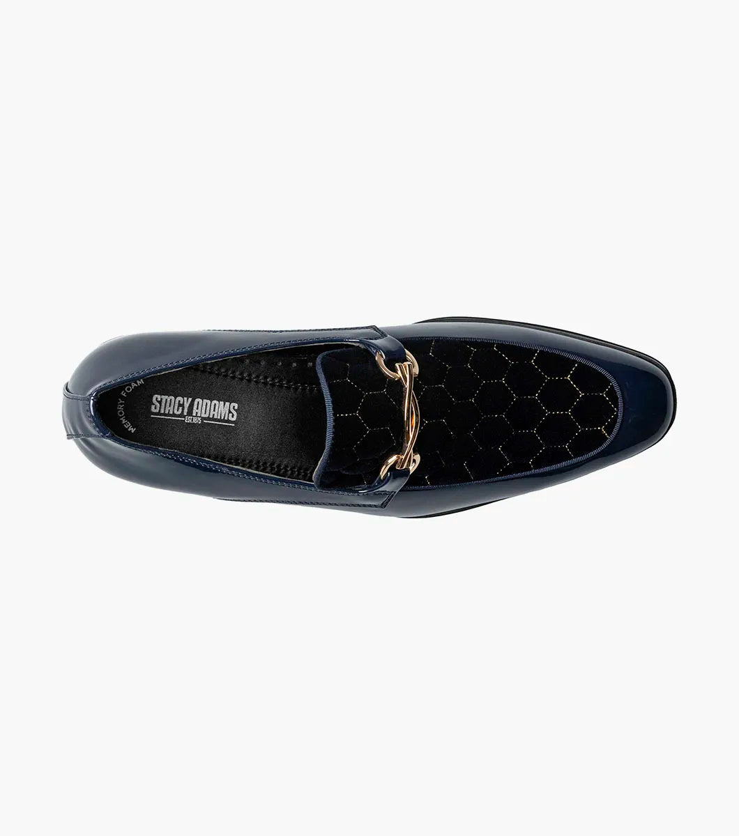 The STACY ADAMS Sprague Moc Toe Bit Slip On (Navy, 25732-410) is a men's loafer featuring a glossy hexagonal-patterned velvet upper and gold metal bit detail—ideal as stylish dress shoes.