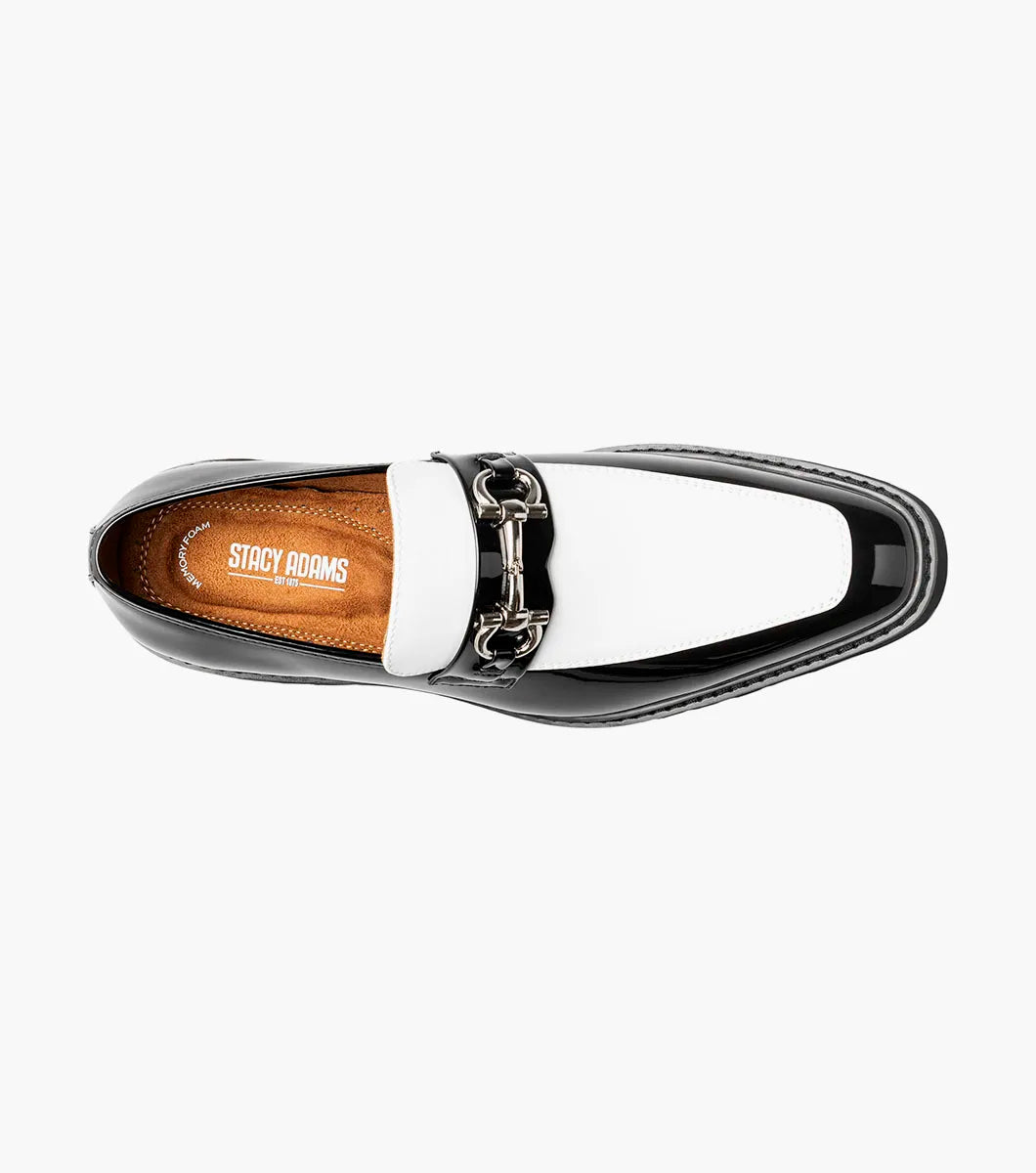 The Stacy Adams Carabello Moc Toe Bit Slip On in Black with White (25804-111) by STACY ADAMS is a black and white loafer featuring a chunky sole, metallic chain detail on the upper, and a comfortable memory foam insole, displayed on a white background.