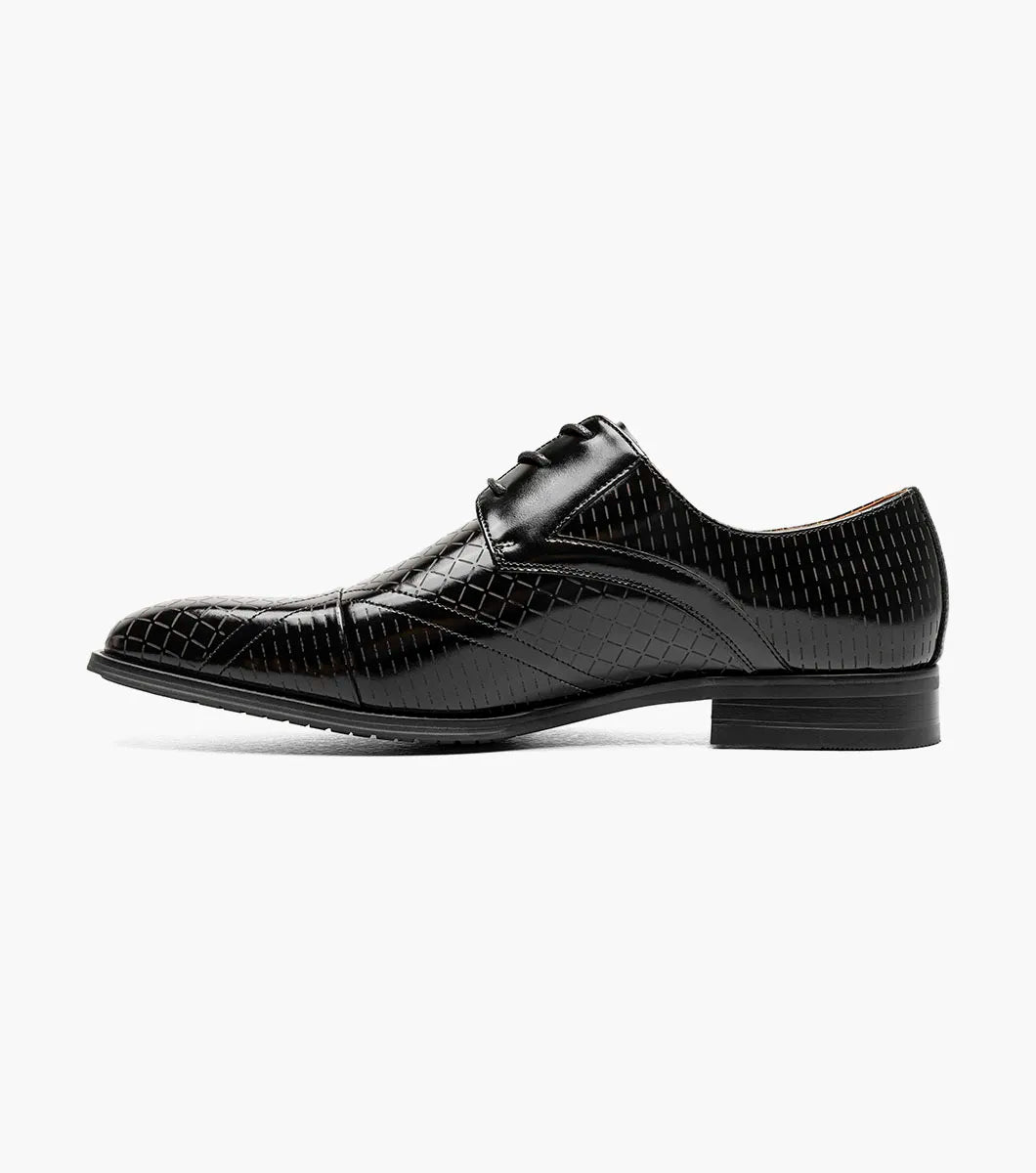 The Stacy Adams Hobson Cap Toe Oxford (25764-001) is a single black dress shoe with shiny, laser-etched geometric leather and black laces, displayed on a plain white background.