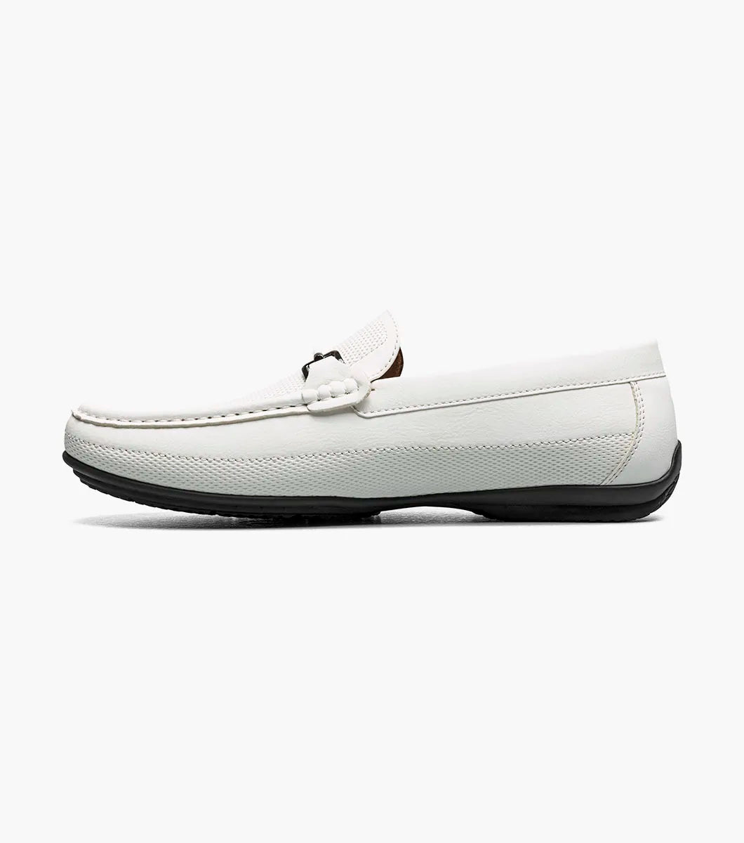 The STACY ADAMS Colton Moc Toe Bit Slip On (White, 25760-100) is a men's leather loafer with a silver bit detail, black sole, patterned heel lining, and cushioned footbed for all-day comfort.