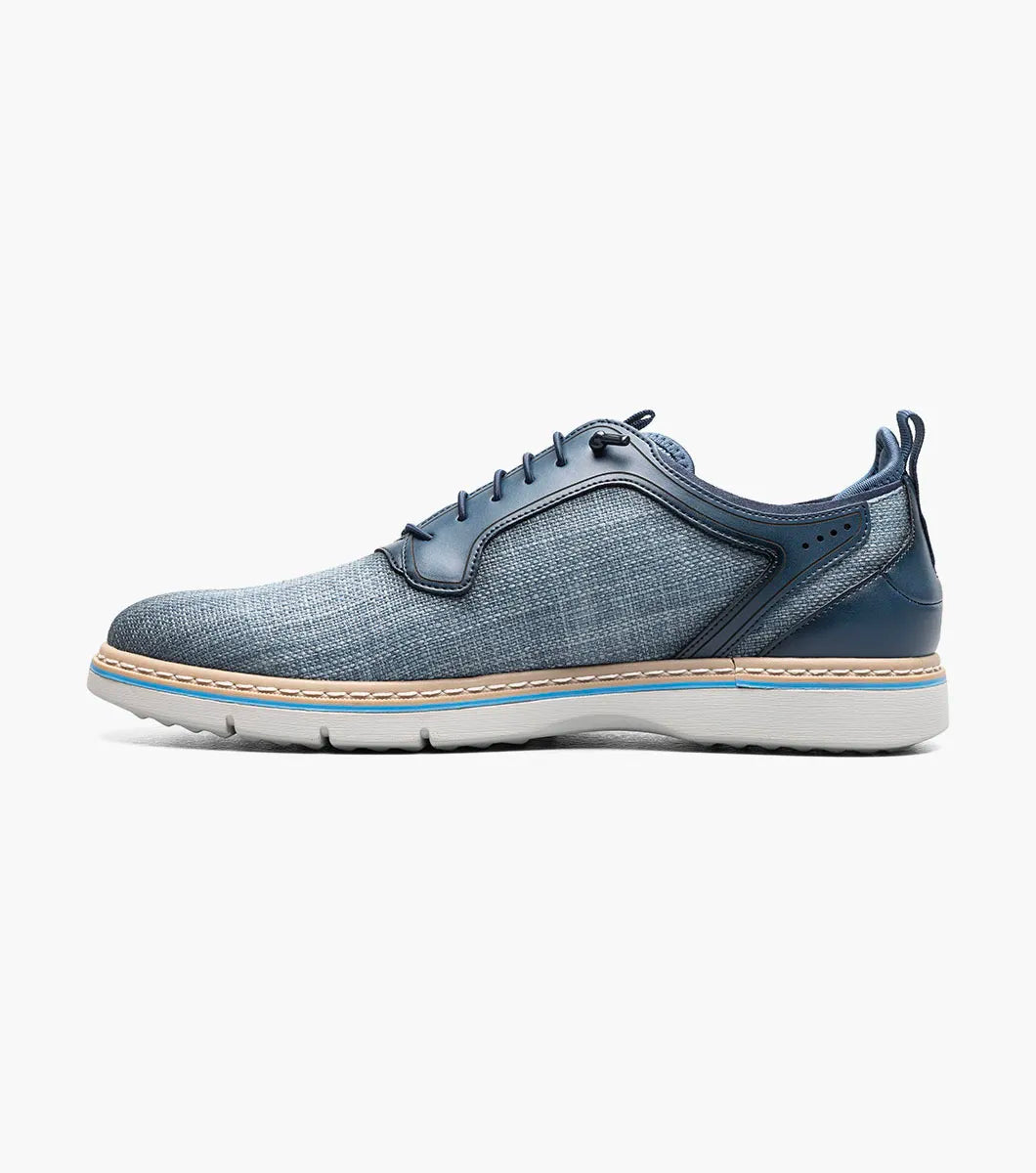 The Stacy Adams Sebert Plain Toe Elastic Lace Up in Navy (25771-410) features a textured upper, smooth leather accents, and a light rubber sole—offering stylish comfort for men. Shown on a plain white background.