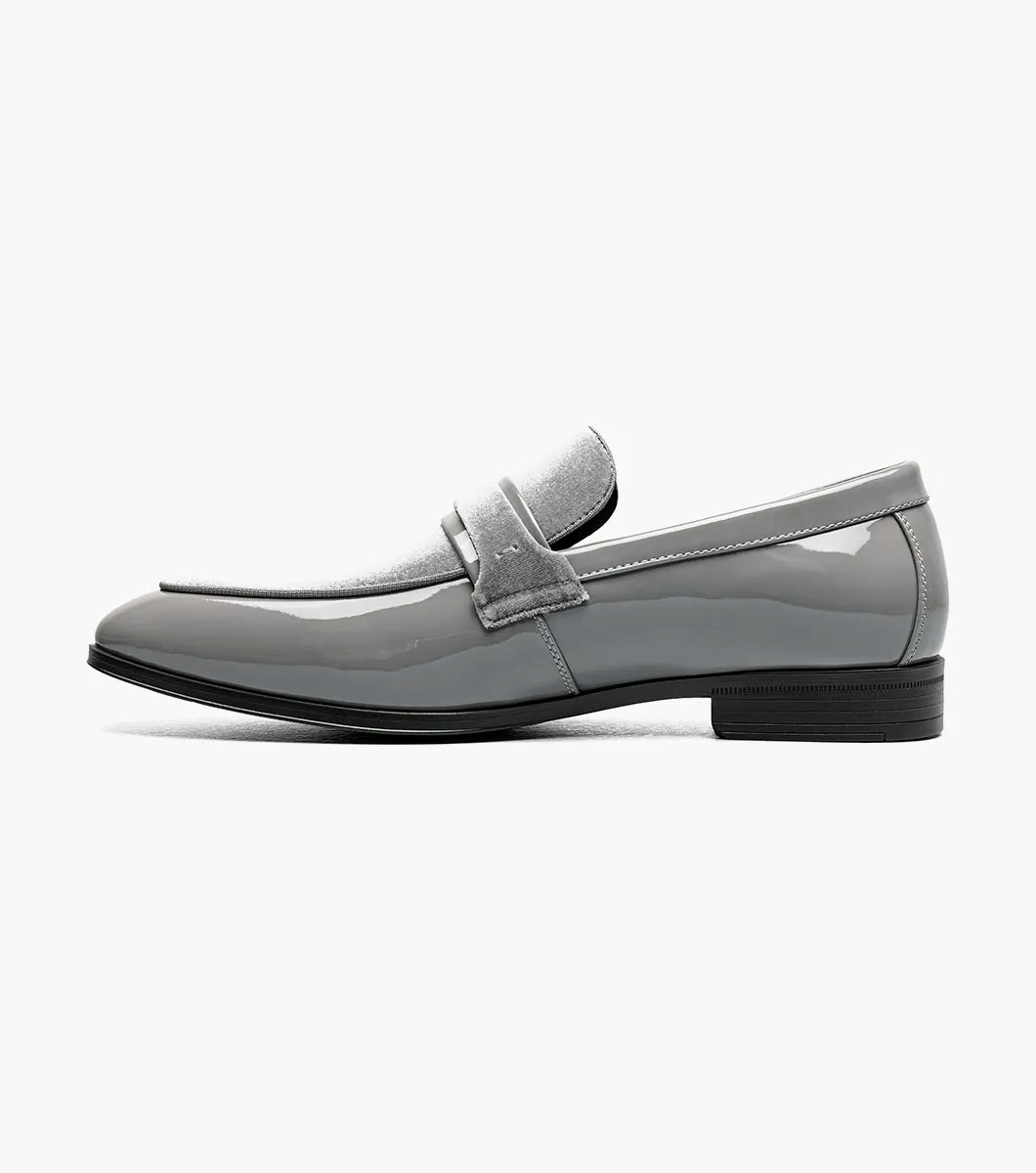 The STACY ADAMS Spratley Moc Toe Saddle Slip On in gray (25686-020) features a velour upper with a shiny patent finish, moc toe slip-on design, low heel, and rounded toe.
