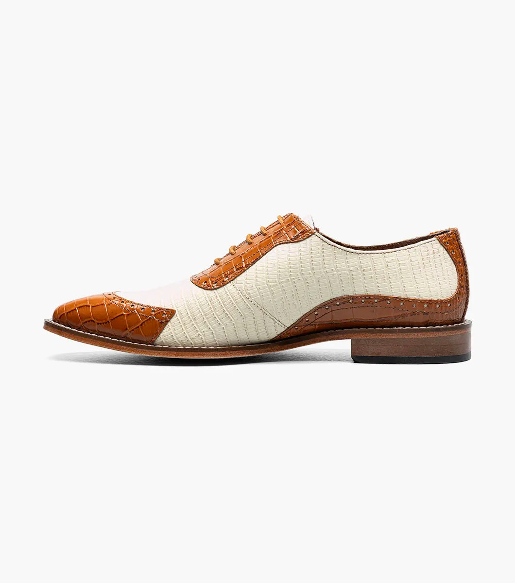 The STACY ADAMS Tarango Modified Cap Toe Oxford in Tan Multi (25770-238) blends tan leather and cream fabric with a closed lace design and low wooden heel—an ideal formal shoe for stylish men.