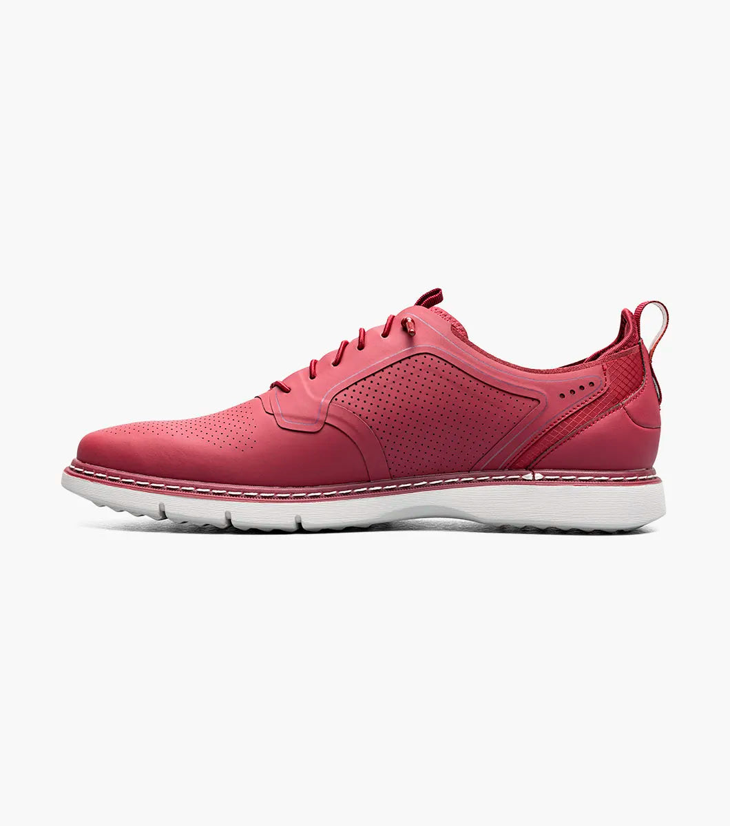 The Stacy Adams Synchro Plain Toe Elastic Lace Up sneaker in Raspberry features perforated detailing, anatomical arch support, and a white sole—shown as a single shoe on a plain white background.
