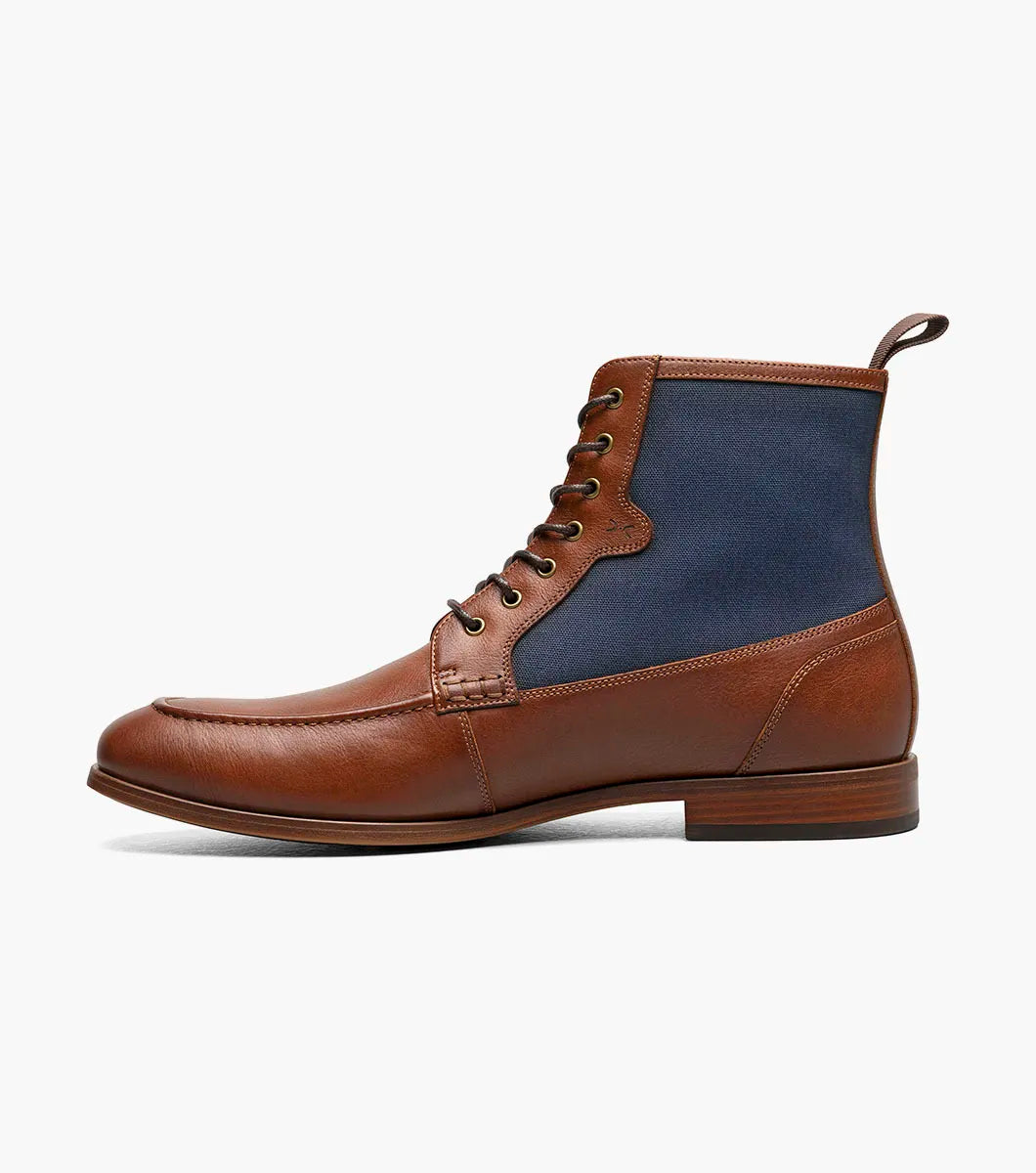 The STACY ADAMS Brumley Moc Toe Lace Up Boot in Tan Multi features burnished leather and navy fabric, a low wooden heel, cushioned footbed, and fabric pull tab.