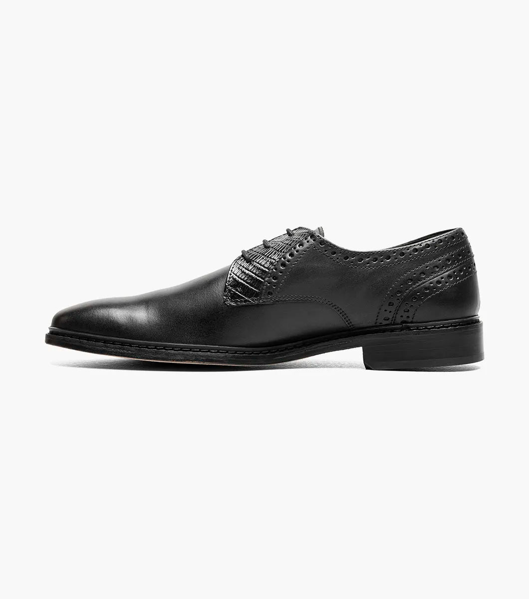 The Stacy Adams Giorgetti Plain Toe Oxford in black features lizard print leather, a low heel, lace-up closure, textured accents by the laces, and a cushioned footbed, shown on a plain white background.