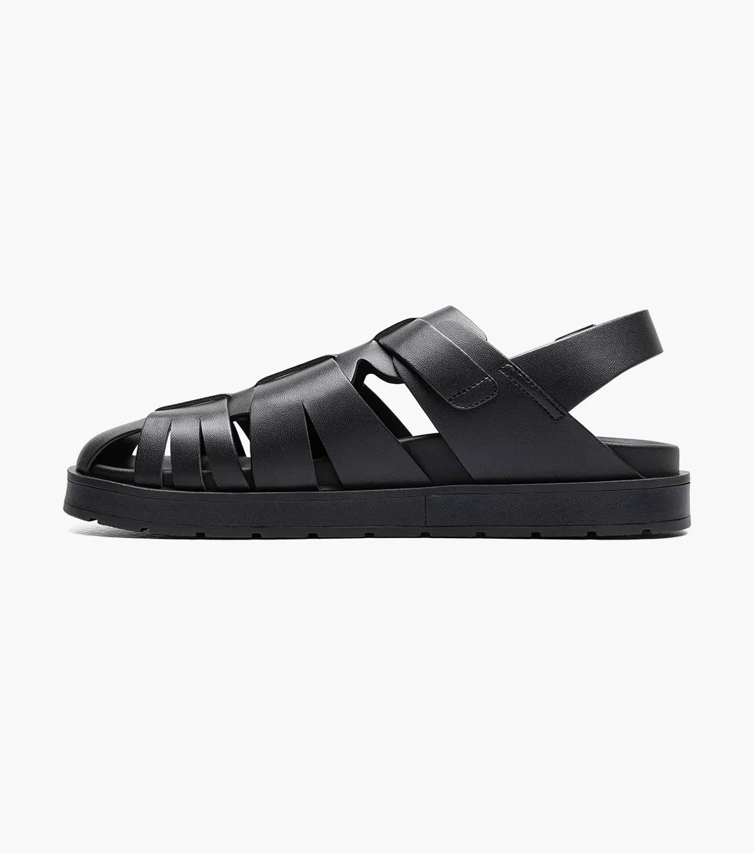The Stacy Adams Largo Slingback Buckle Sandal (25773-001) features black leather woven straps, an open toe, closed heel, cushioned sole, and adjustable buckles—perfect men’s summer footwear. Shown on a white background.