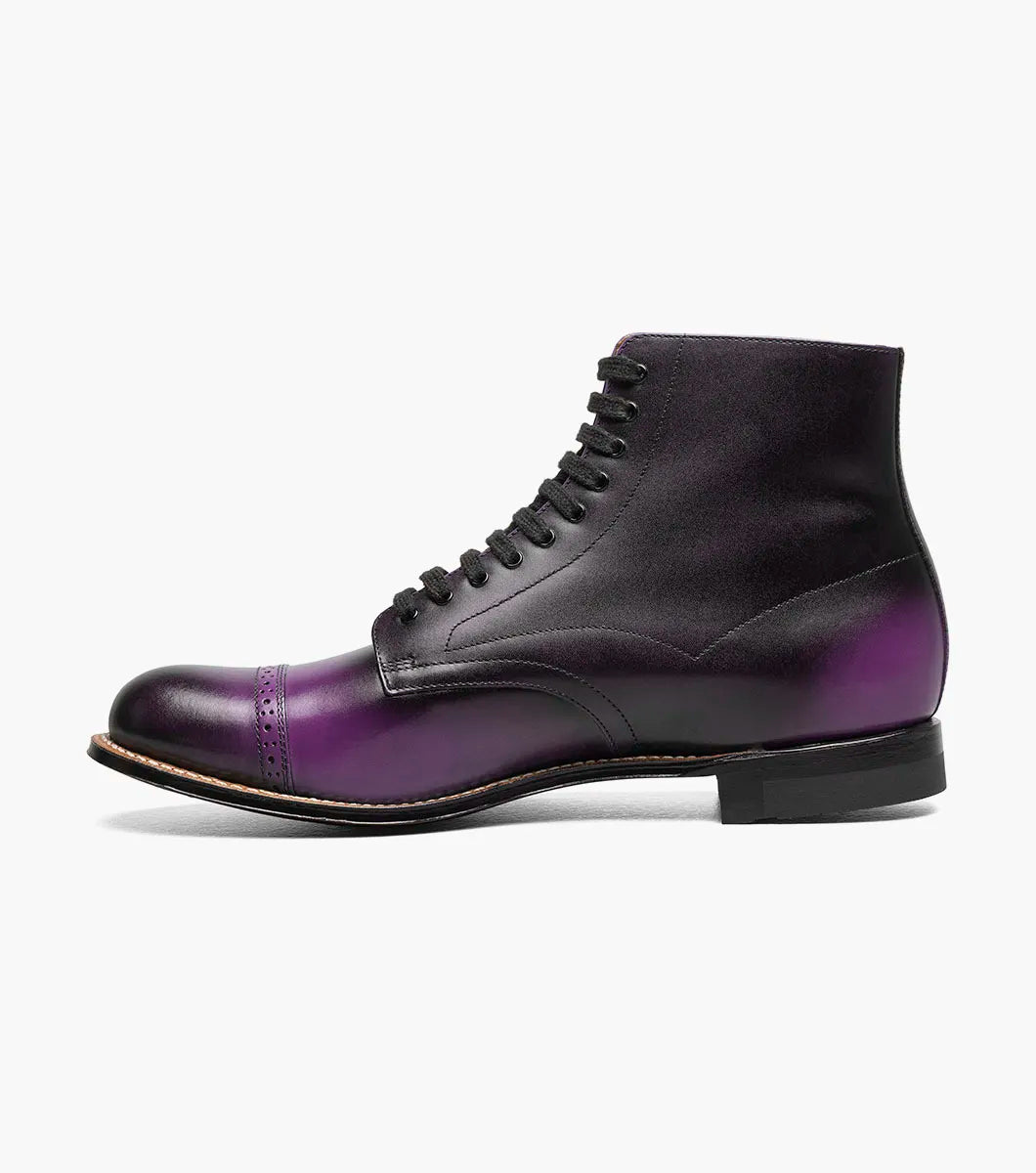 A single STACY ADAMS Madison Cap Toe Lace Up Boot in purple (00110-542) with black laces and brogue detailing is displayed on a plain white background.