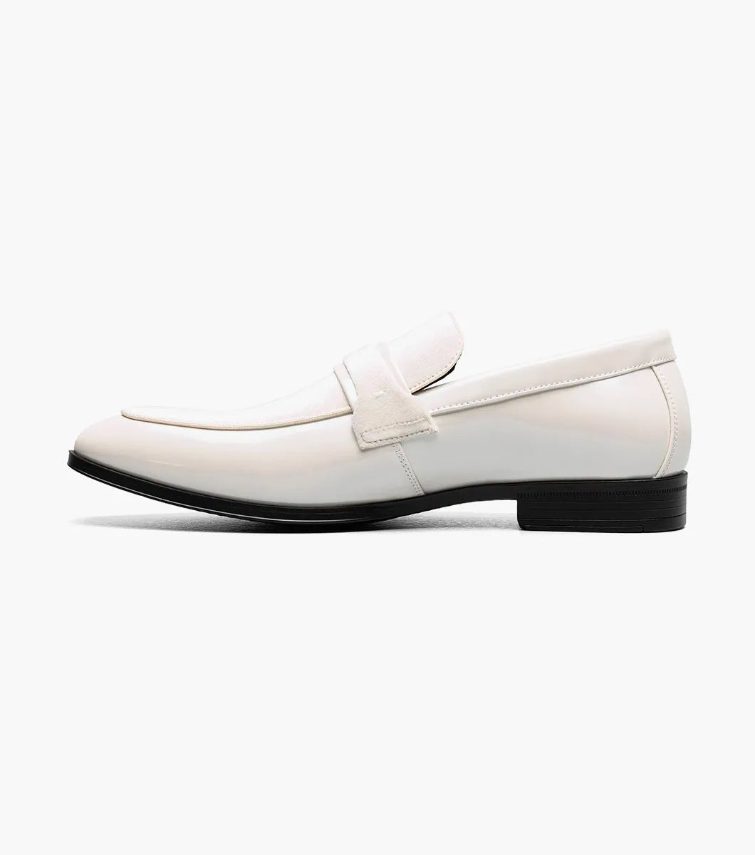 The STACY ADAMS Spratley Moc Toe Saddle Slip On in ivory features a cream velour upper with suede panel, low black heel, and almond toe for a sophisticated men's loafer.