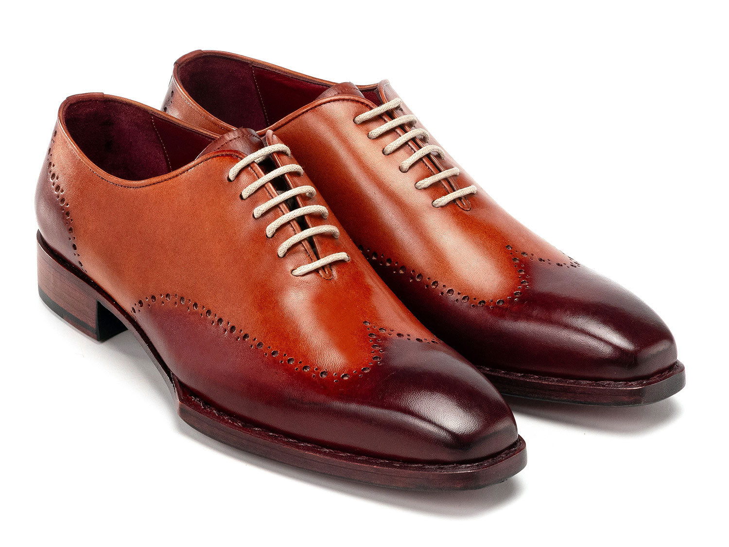 The Paul Parkman Goodyear Welted Wingtip Oxfords Bordeaux & Camel - 081-RDT feature two-tone brown and burgundy hues with brogue detailing, shown on a white background.