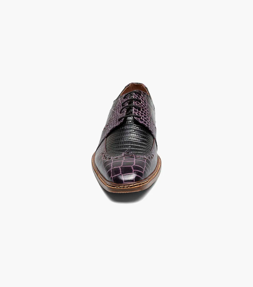 A single STACY ADAMS Travato Wingtip Oxford (Purple Multi, 25737-540) men’s dress shoe with a brown sole and lace-up closure is shown on a white background.