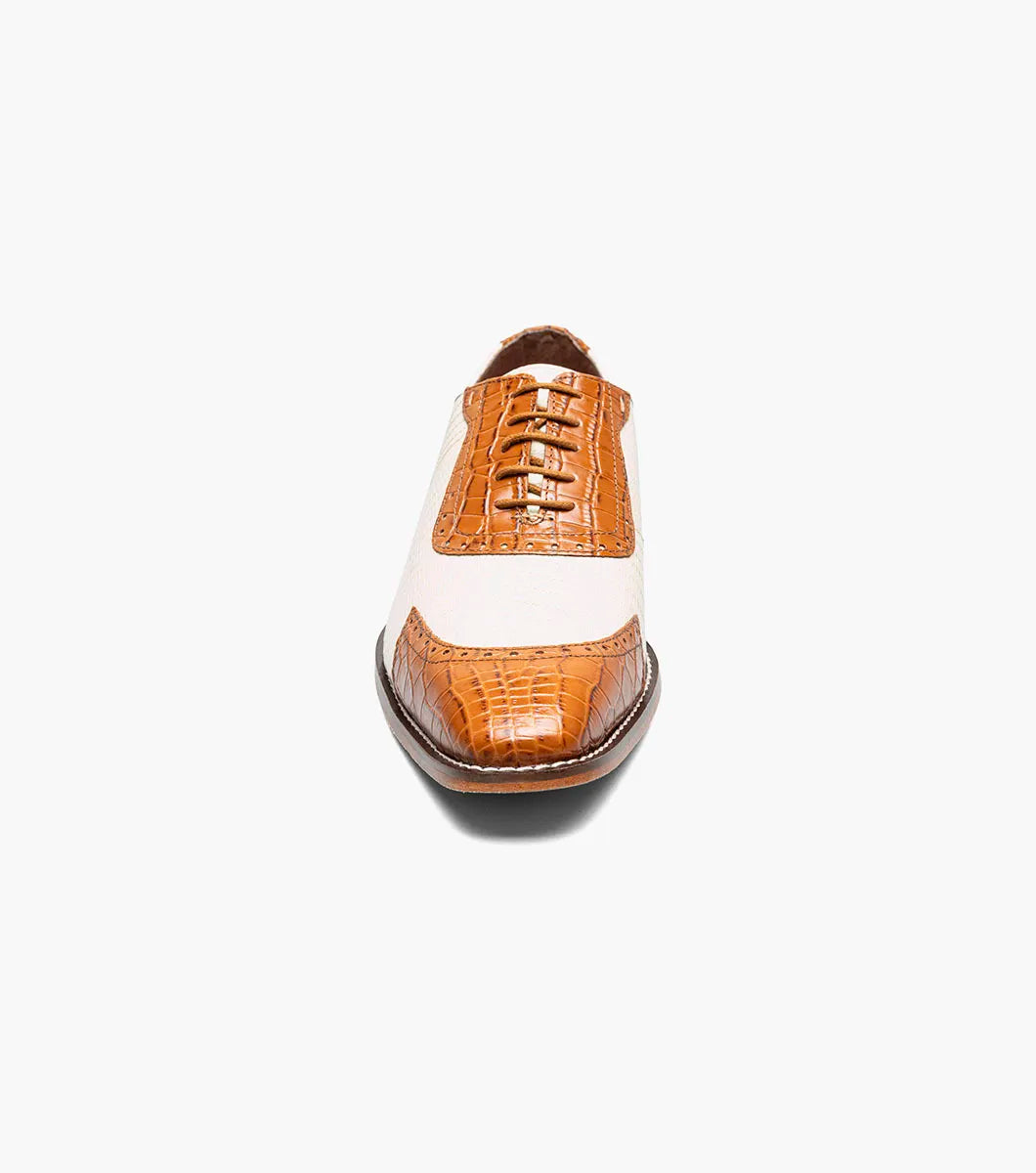 The STACY ADAMS Tarango Modified Cap Toe Oxford in Tan Multi (25770-238) blends tan leather and cream fabric with a closed lace design and low wooden heel—an ideal formal shoe for stylish men.