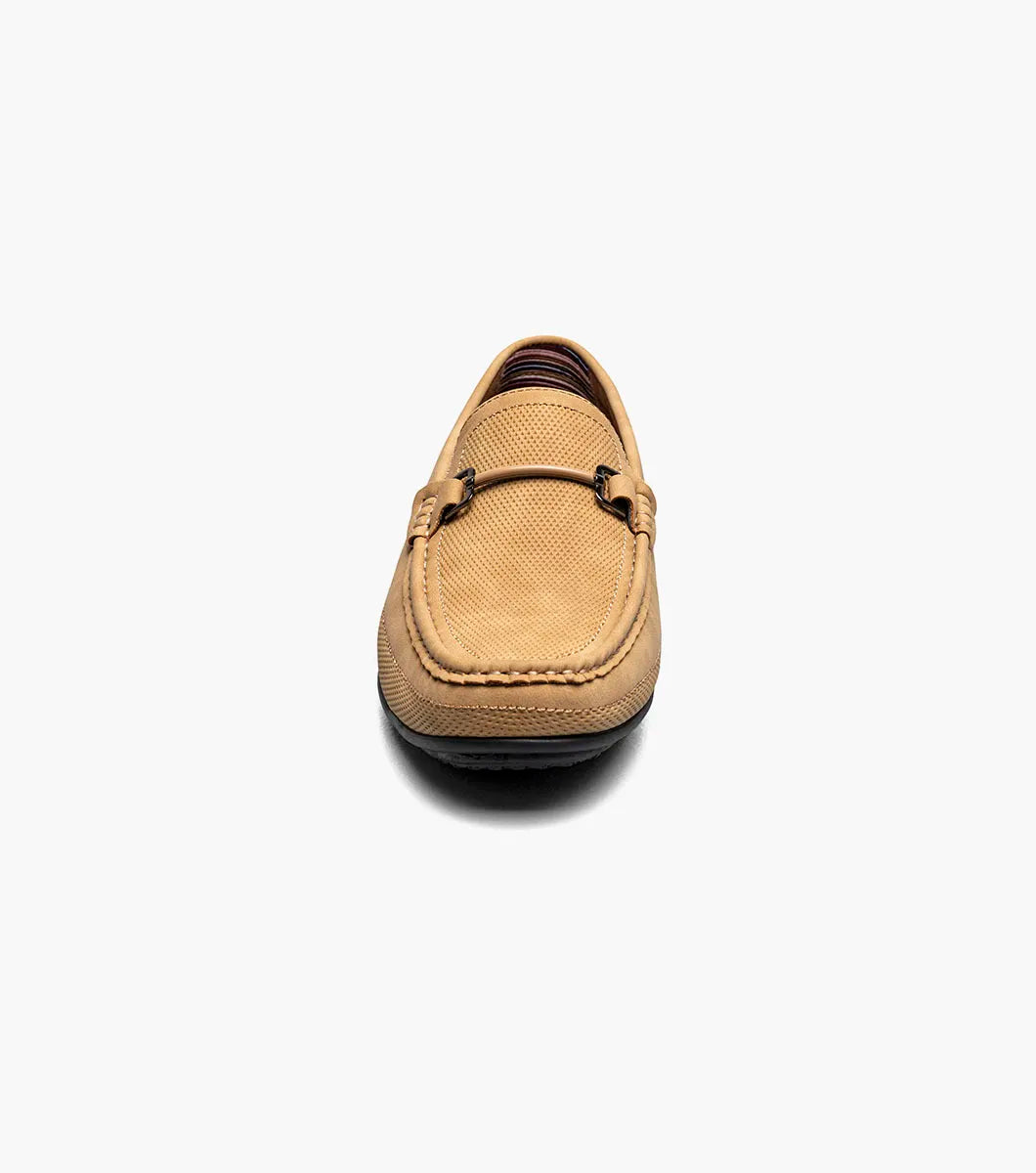The Stacy Adams Colton Moc Toe Bit Slip On in khaki features a stitched moc toe, metal bit detail, black rubber sole, multicolored striped lining, and cushioned footbed for all-day comfort.